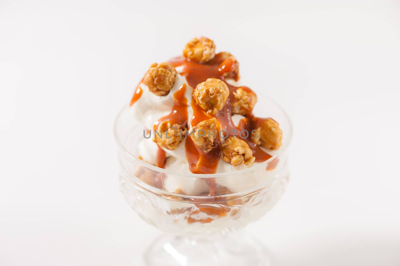 Vanilla ice cream with pop corn and Thai tea caramel sauce