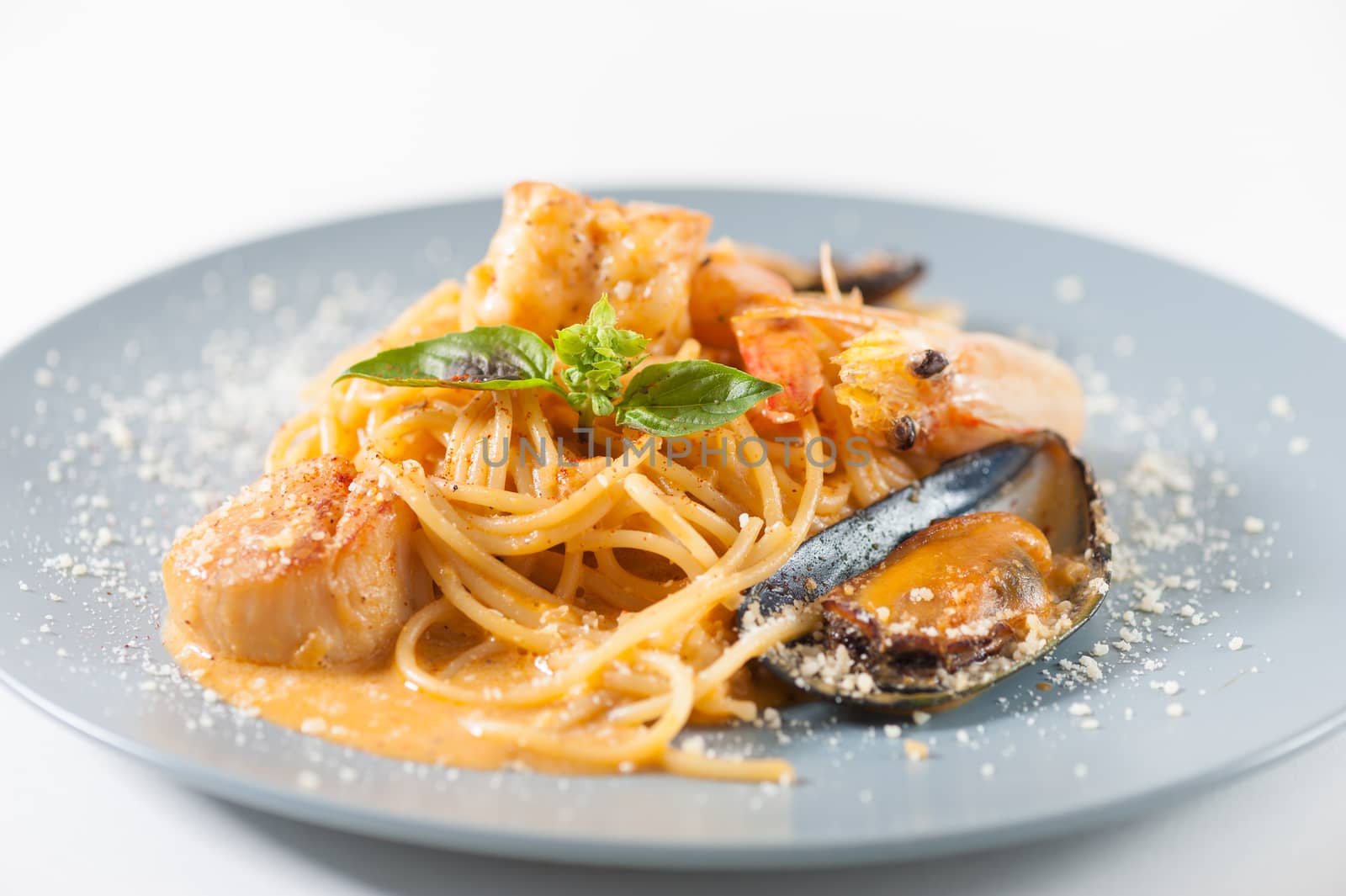 pasta with mussels, shrimp, scallop dressed with Thai style spicy sauce (Tom Yum)