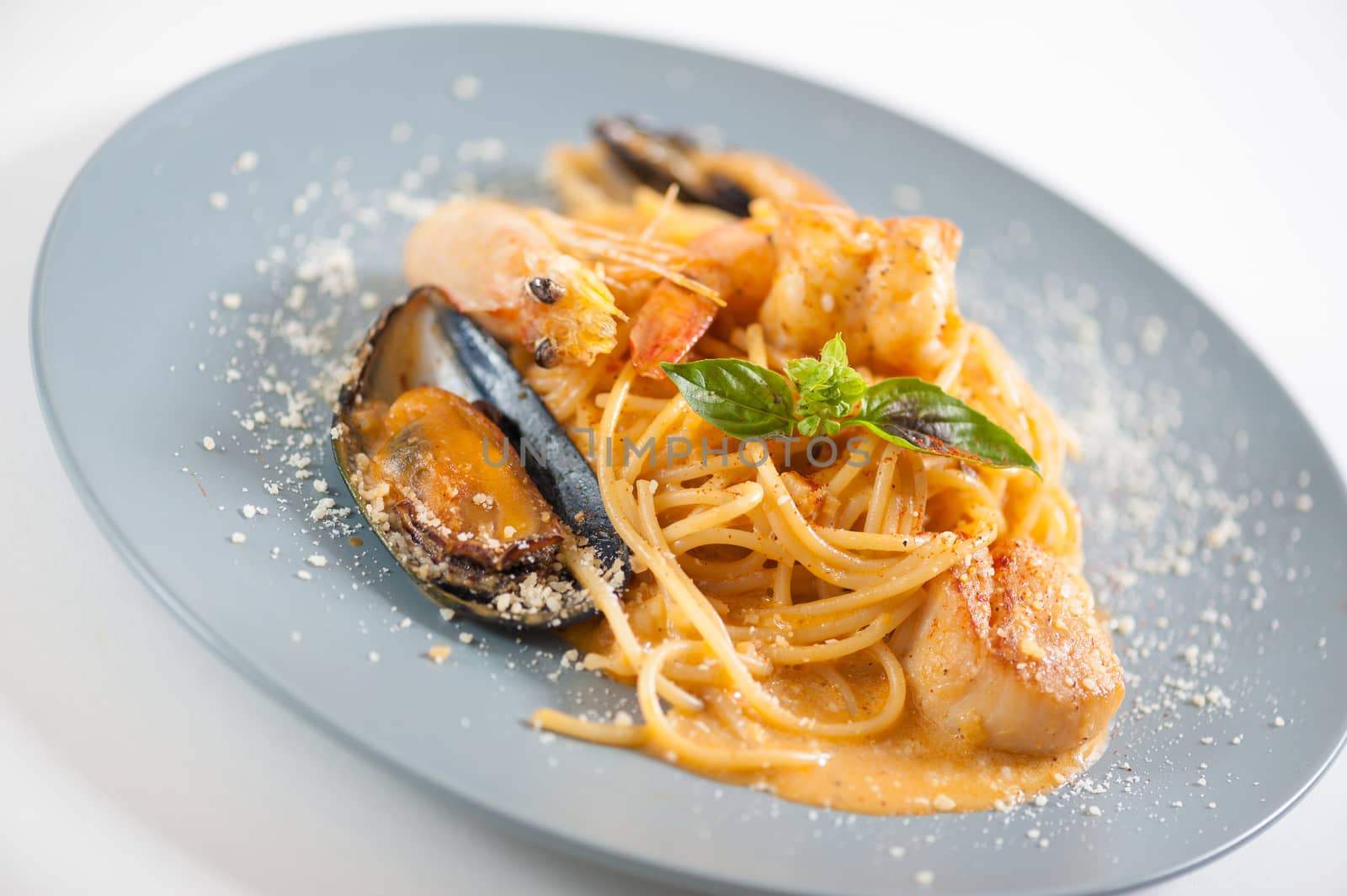 pasta with mussels, shrimp, scallop dressed with Thai style spicy sauce (Tom Yum)