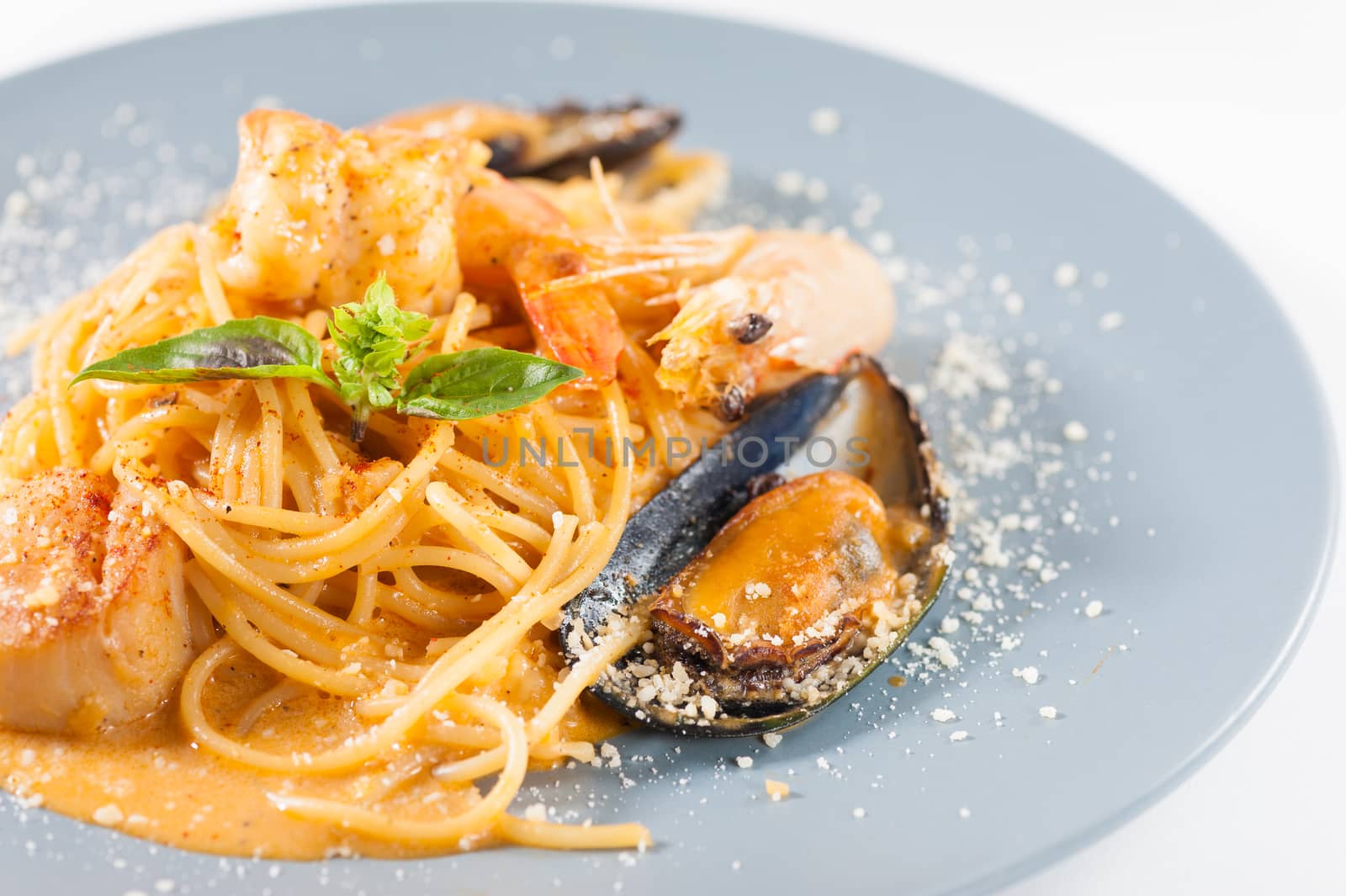 pasta with mussels, shrimp, scallop dressed with Thai style spicy sauce (Tom Yum)