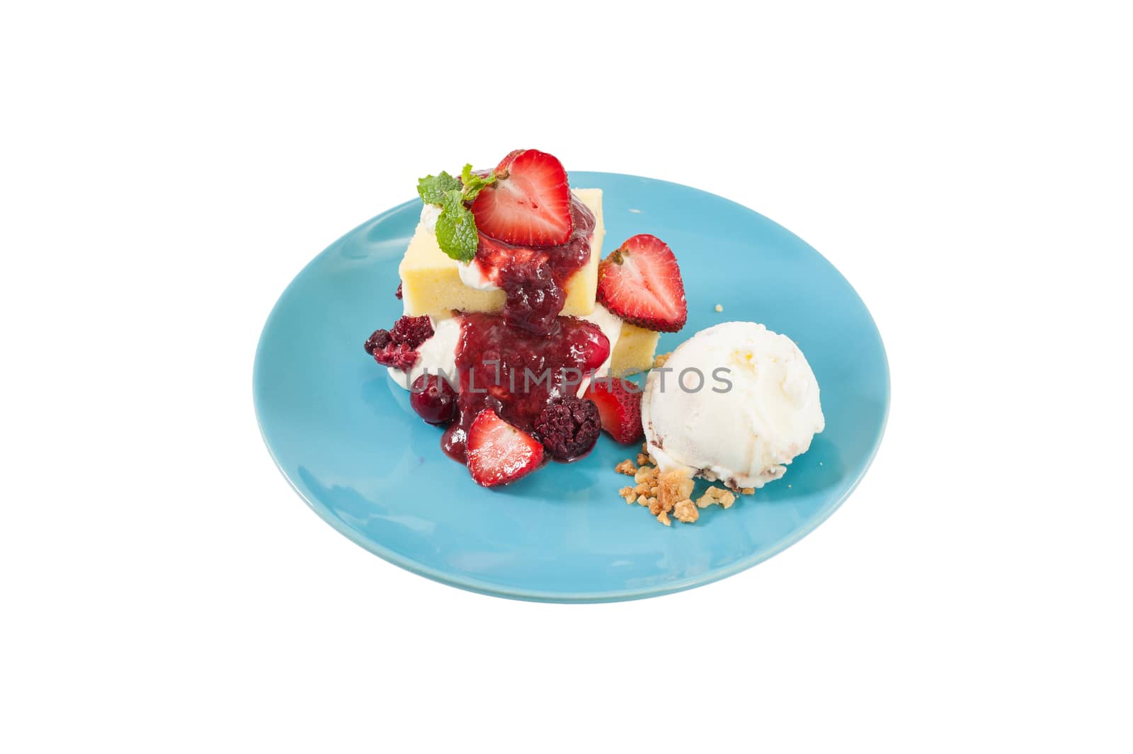 Yellow cake and vanilla ice cream dressed with strawberry sauce on blue dish isolated on white background with clipping path