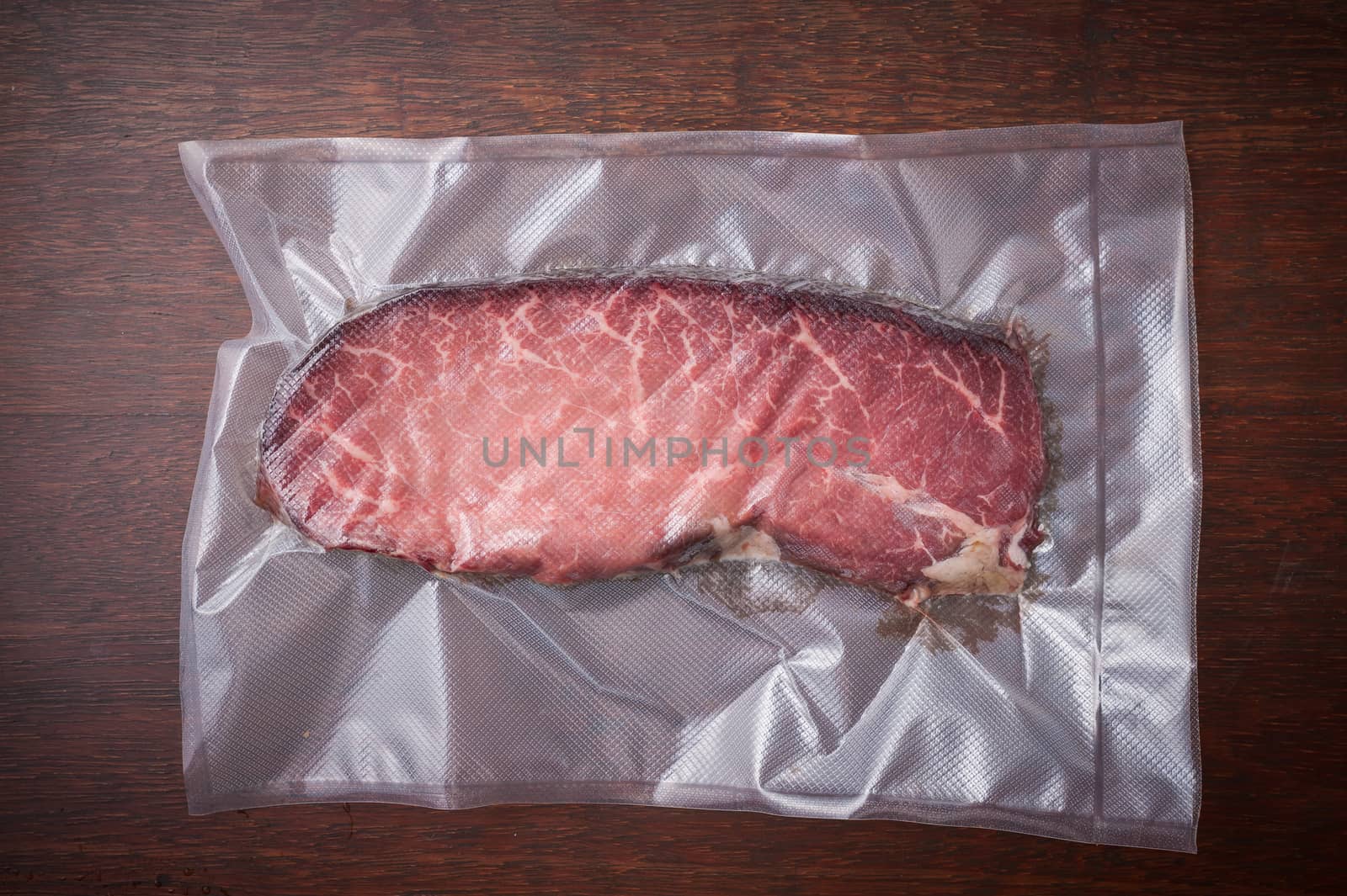 Dry-aged beef in plastic seal package
