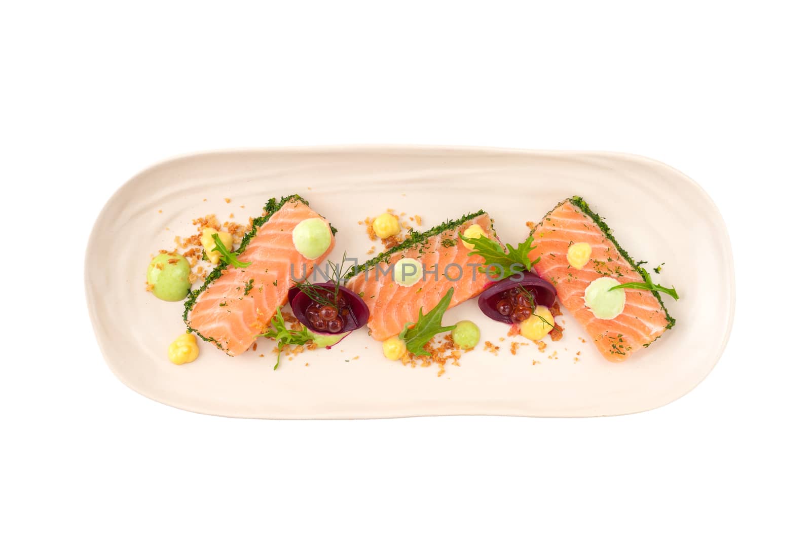 Smoked salmon with herbs, beetroot, faked salmon roe (sauce cooked by molecular gastronomy technic) garnished with mago sauce and wasabi mayo isolated on white background with clipping path