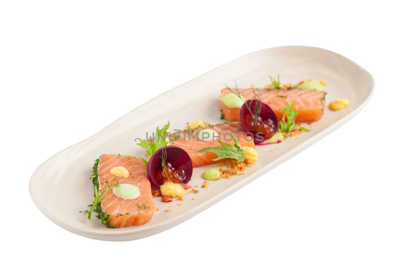Smoked salmon with herbs, beetroot, faked salmon roe (sauce cooked by molecular gastronomy technic) garnished with mago sauce and wasabi mayo isolated on white background with clipping path