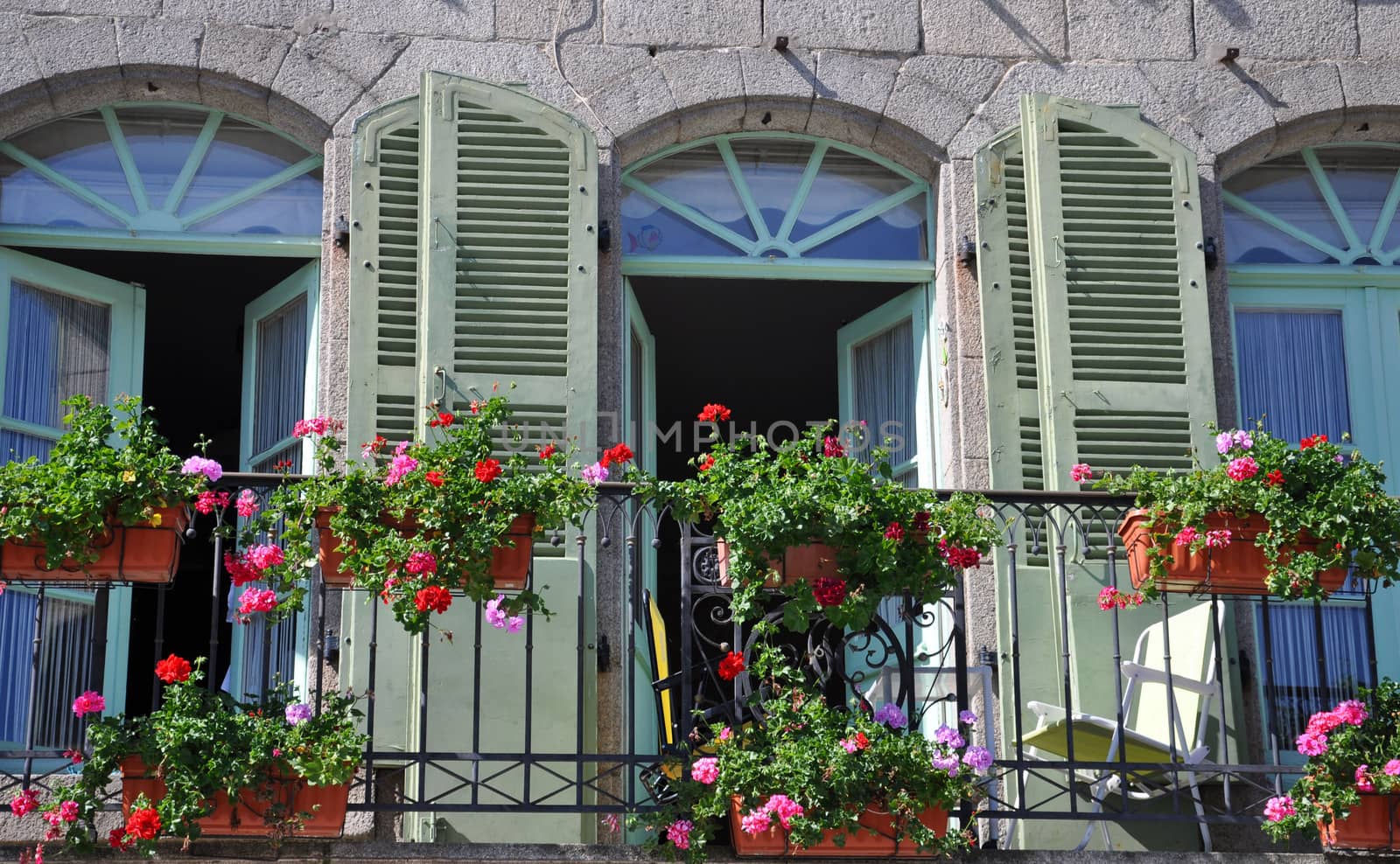 A beautiful balcony on a riverside house in the medieval town of Dinan in Brittany, France