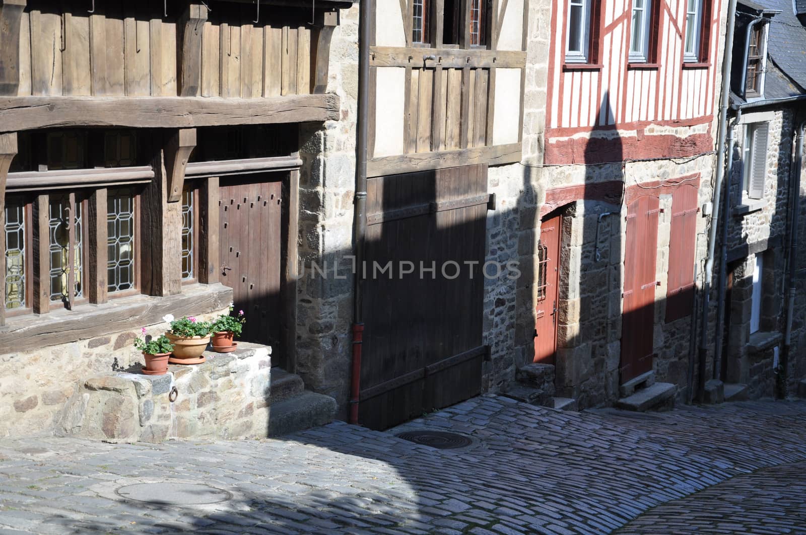 Medieval half-timbered buildings in the ancient french town of Dinan in Brittany. These old houses are in the Rue de Jerzual, which leads into the Rue du Petit Port and then to the River Rance.