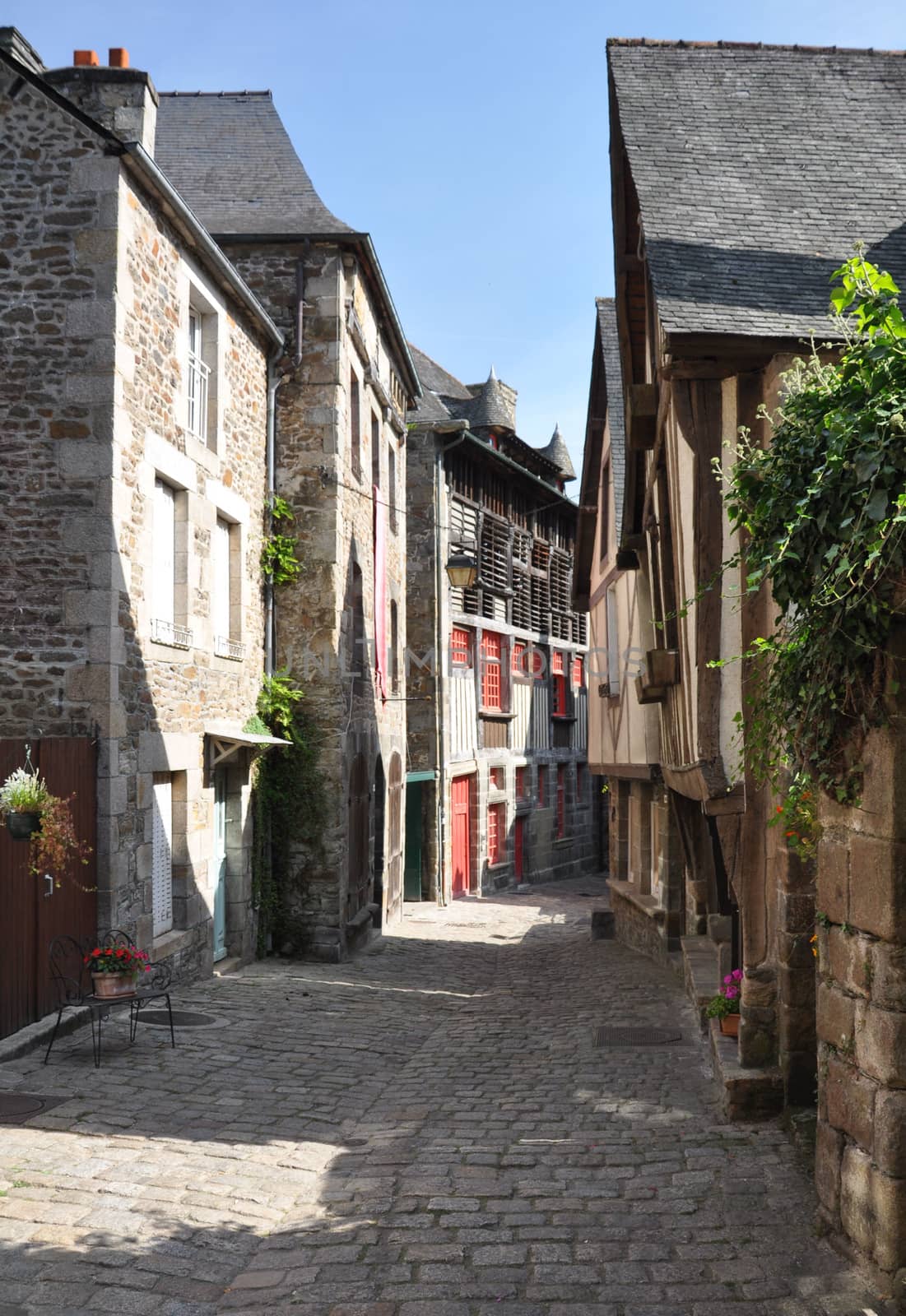 Medieval buildings in the ancient french town of Dinan in Brittany. These old houses are in the Rue du Petit Port which leads to the River Rance and port area of the town.