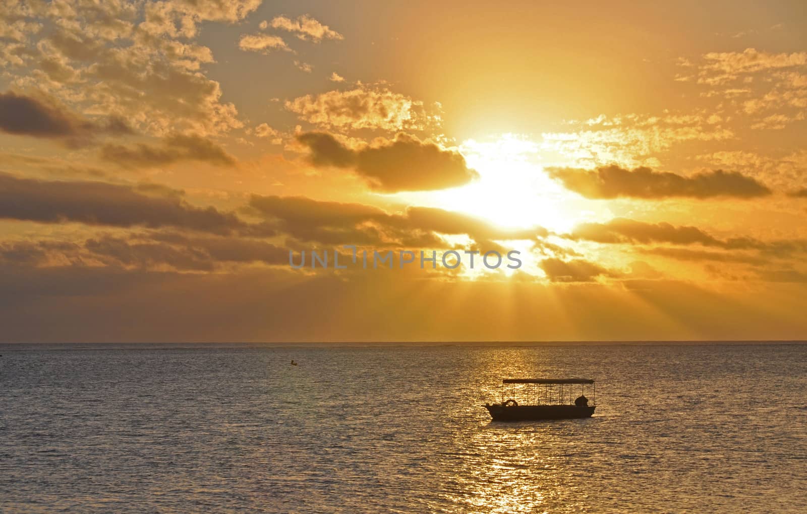 The tranquil beaches of the  South Pacific Ocean really are paradise found. This sunset is over the Coral Coast on the island of Viti Levu (Fiji)