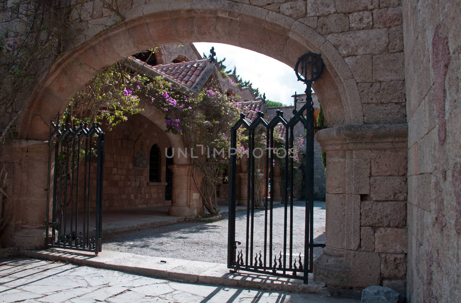 Gated entrance to the Cloisters and Medieval Frescoes at Ialyssos monastery on the Greek island of Rhodes. Built on the top of Mount Filerimos