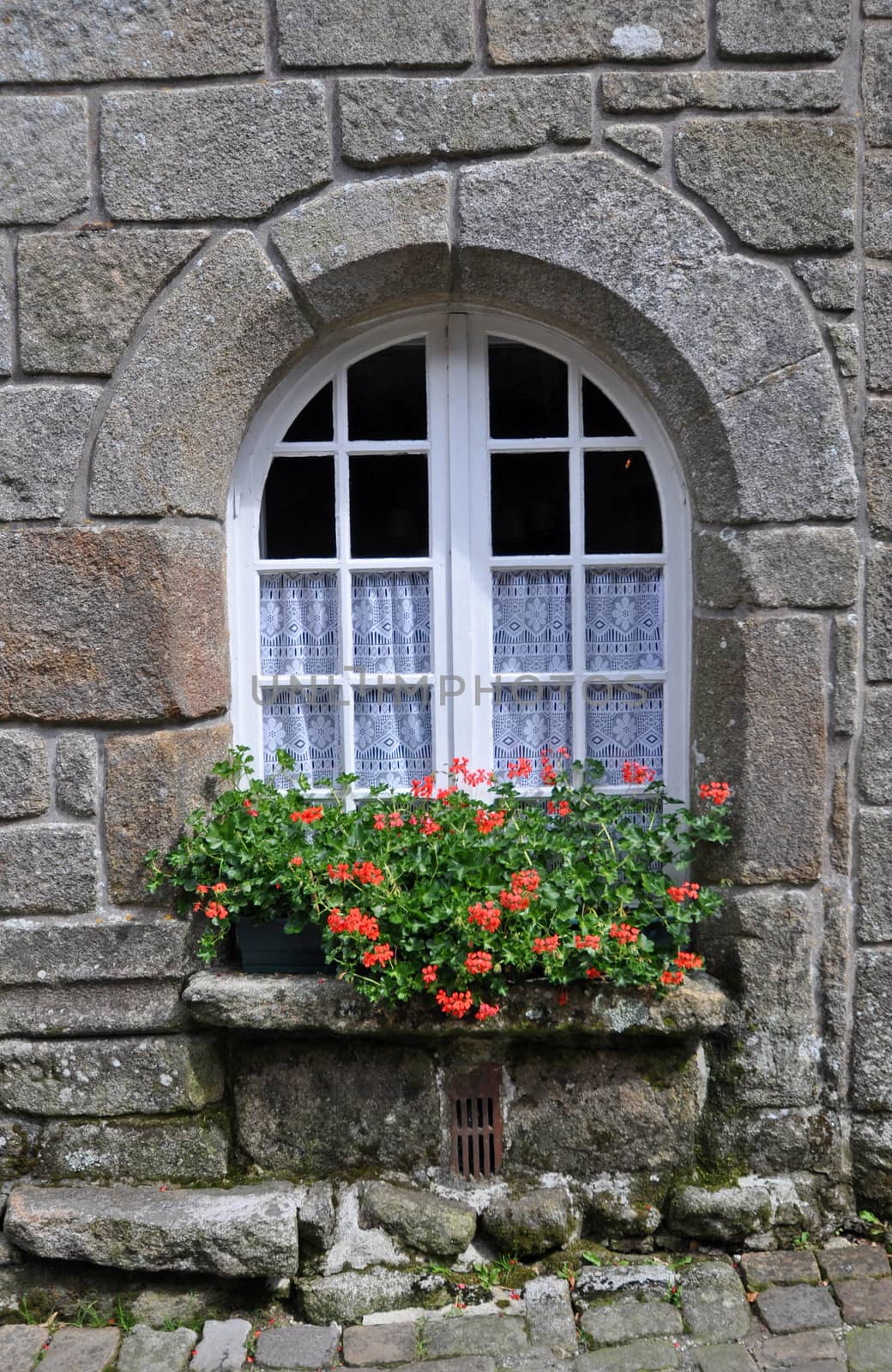 Floral window display in the village of Locronan, in Brittany, rural France