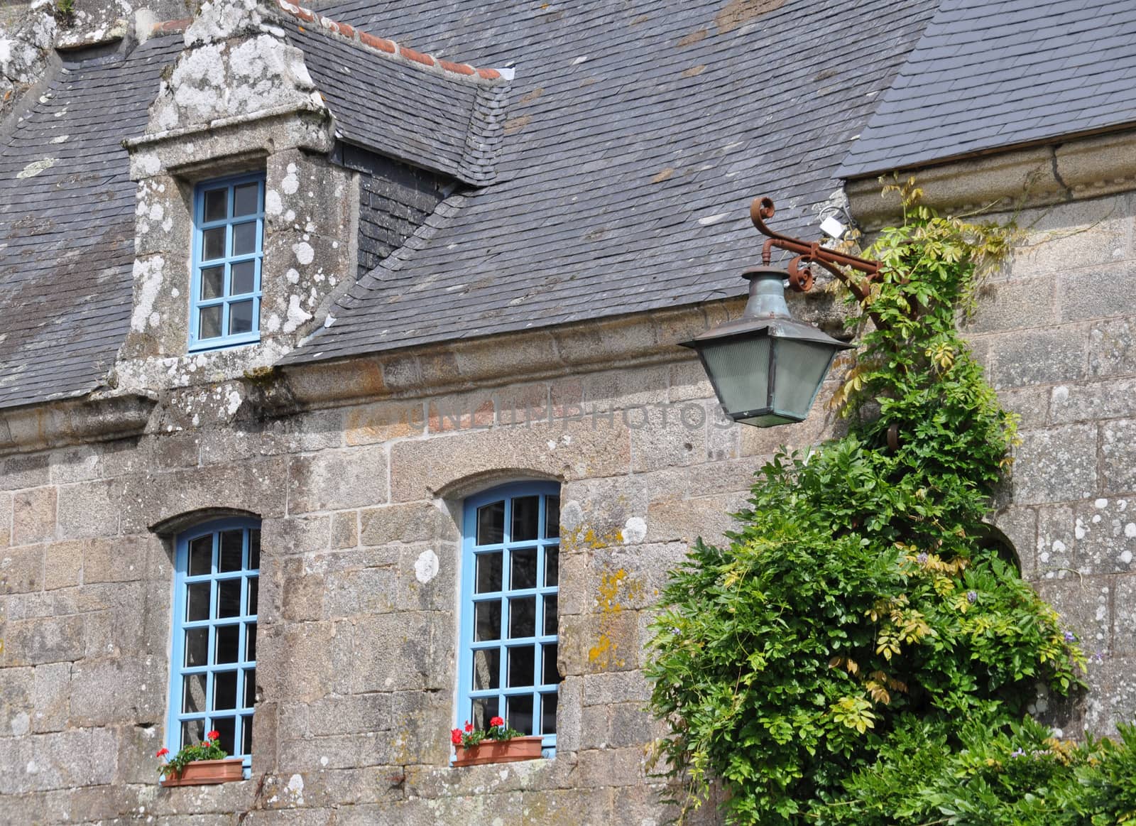 Old lamp in Locronan, Brittany, France.