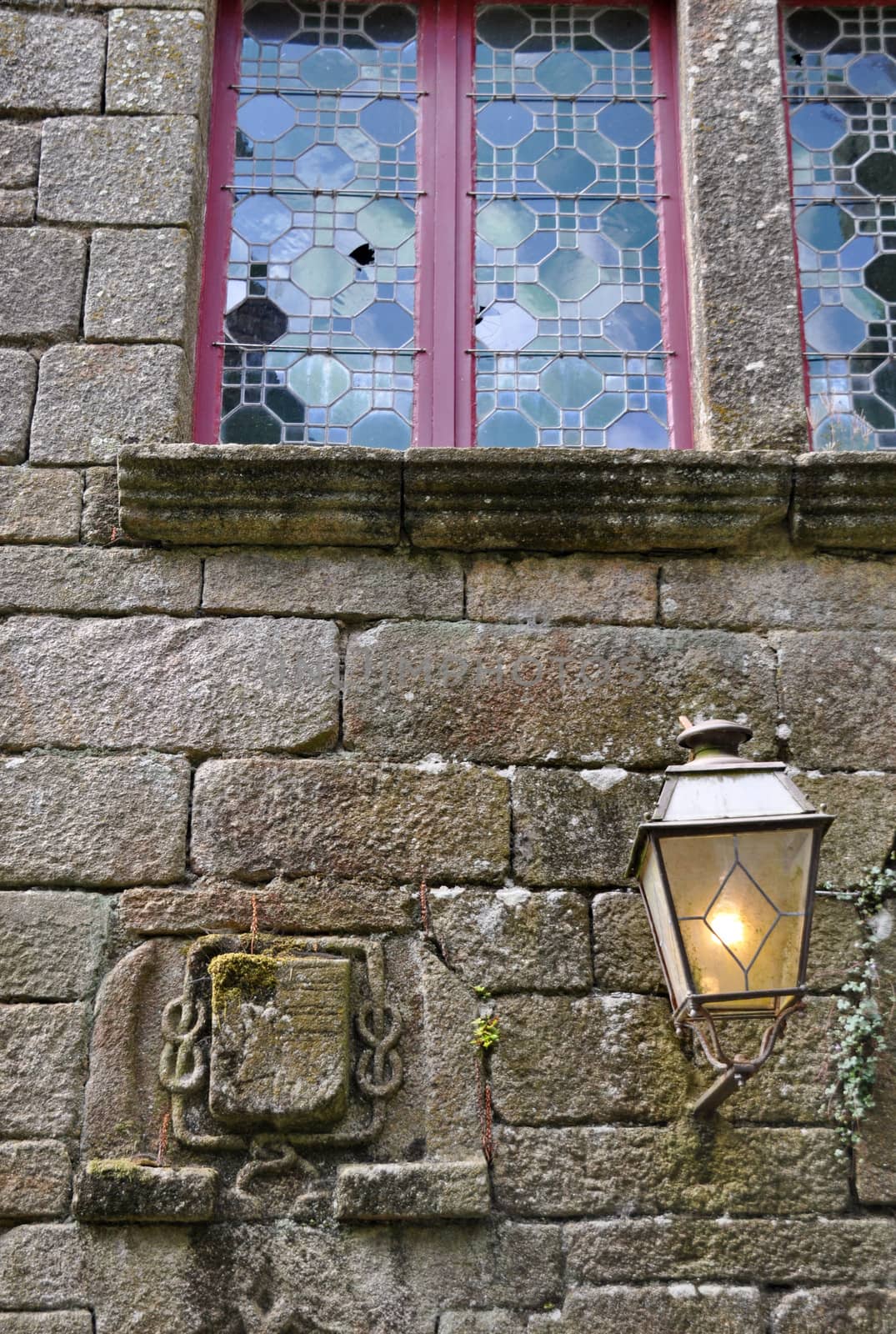 Old lamp in Locronan, Brittany, France.