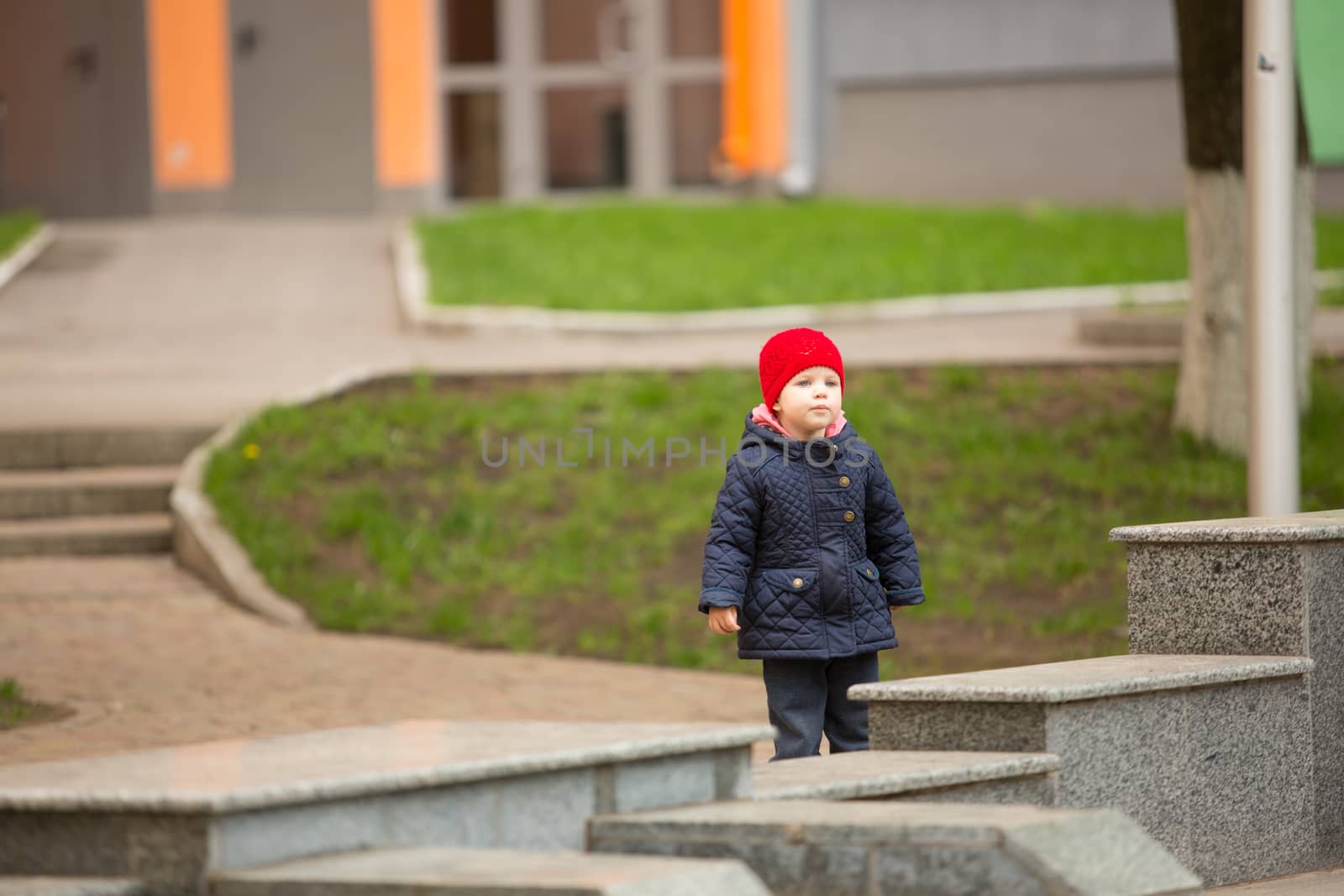 cute little girl playing in the park in spring