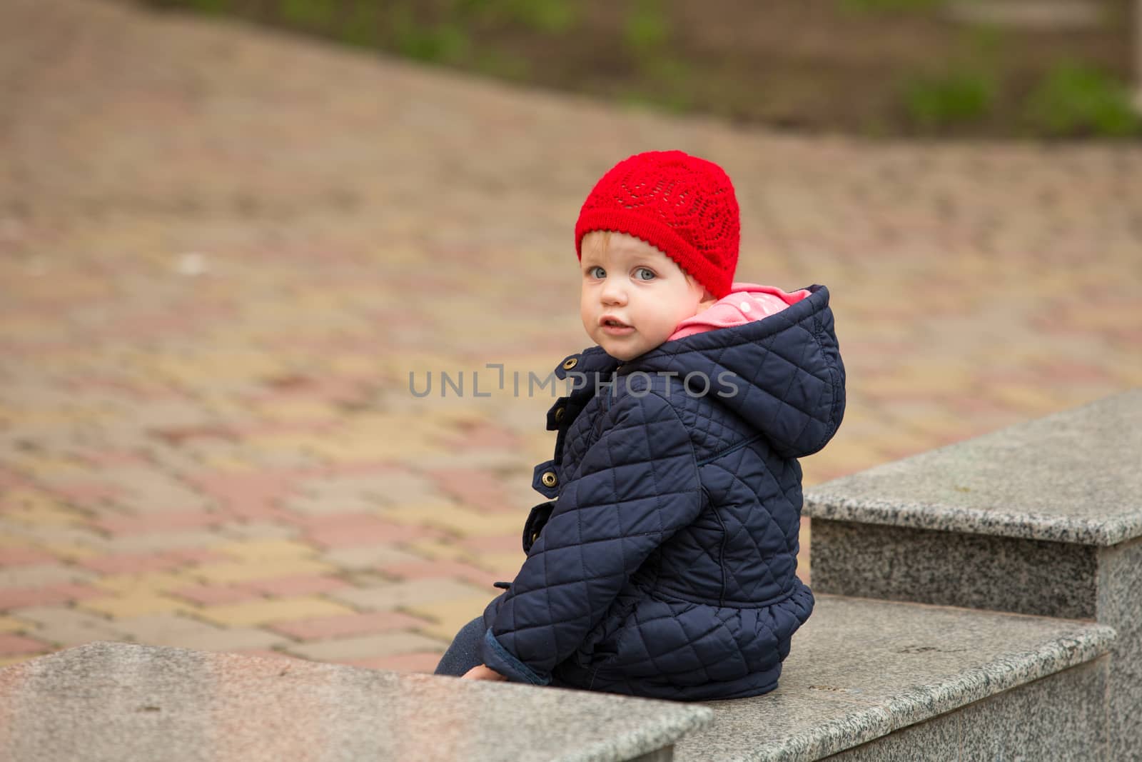 girl playing in a spring park in a playground