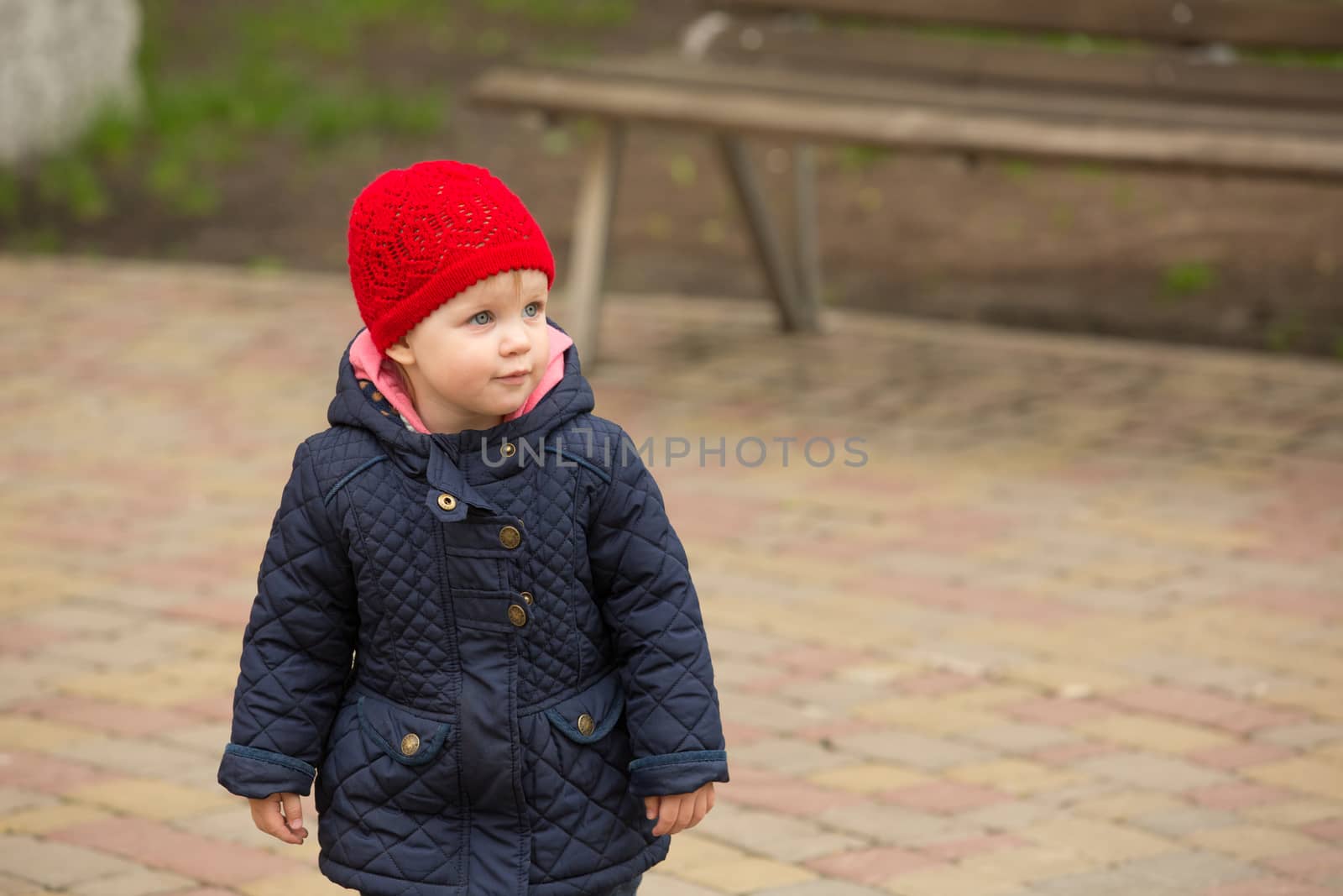 beautiful little girl in the park by sarymsakov