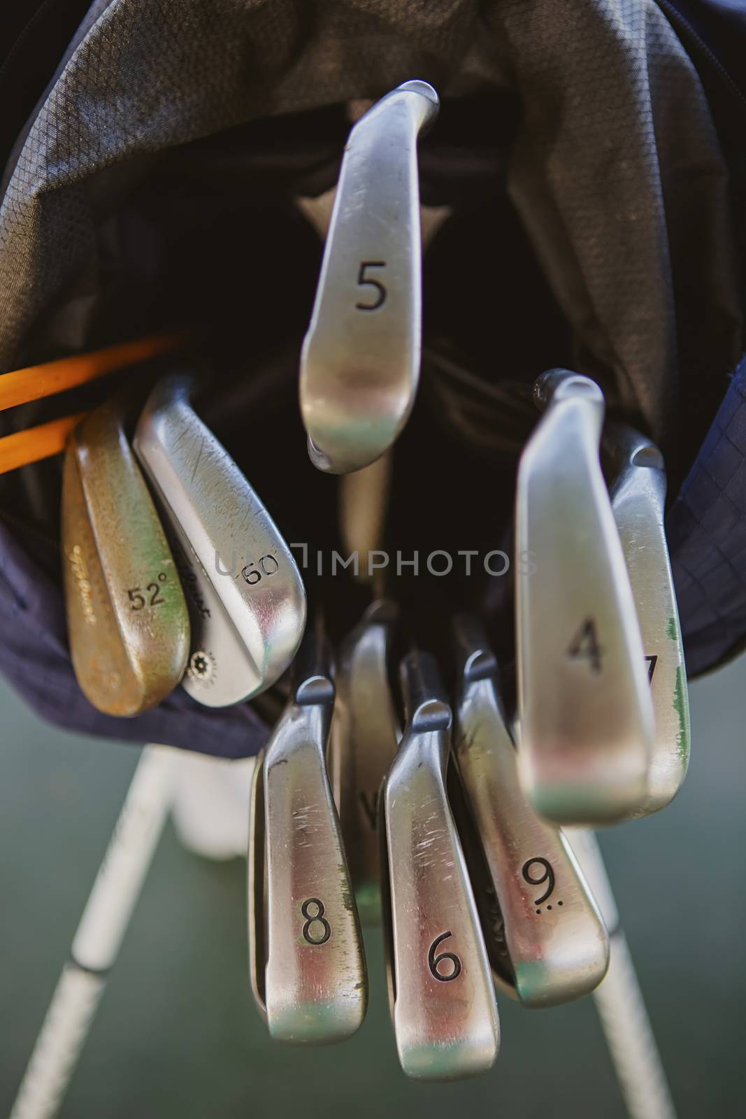 Dirty golf clubs in bag. Shallow dof