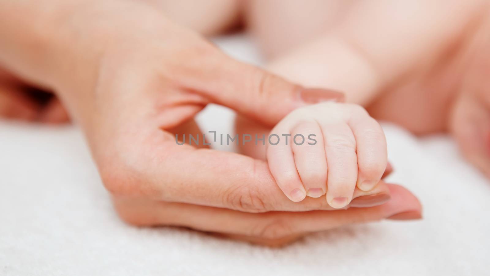 sleeping baby in hand of parent  by sarymsakov