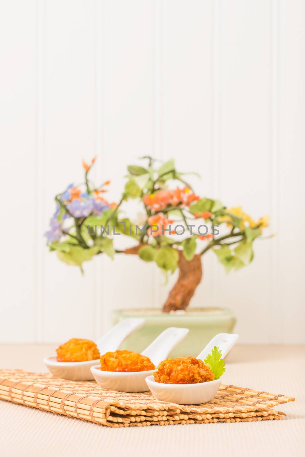 Coconut crusted fried chicken with a savory dipping sauce.