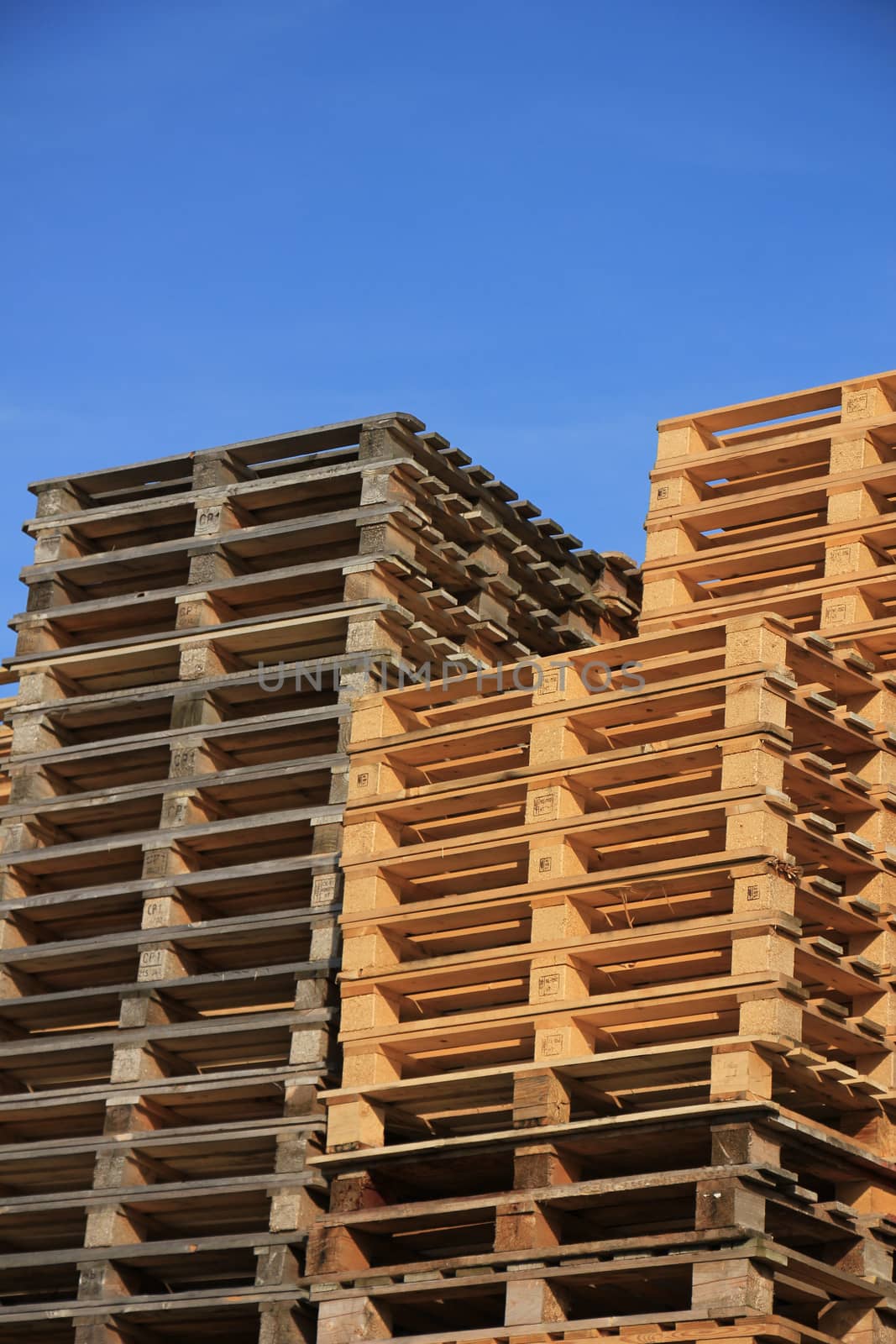 Stacked wooden pallets at a pallet storage