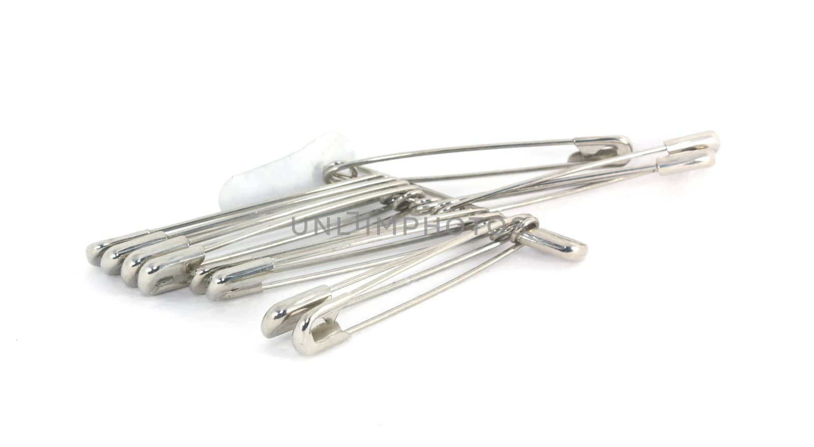 Bunch of safety pins isolated on white background