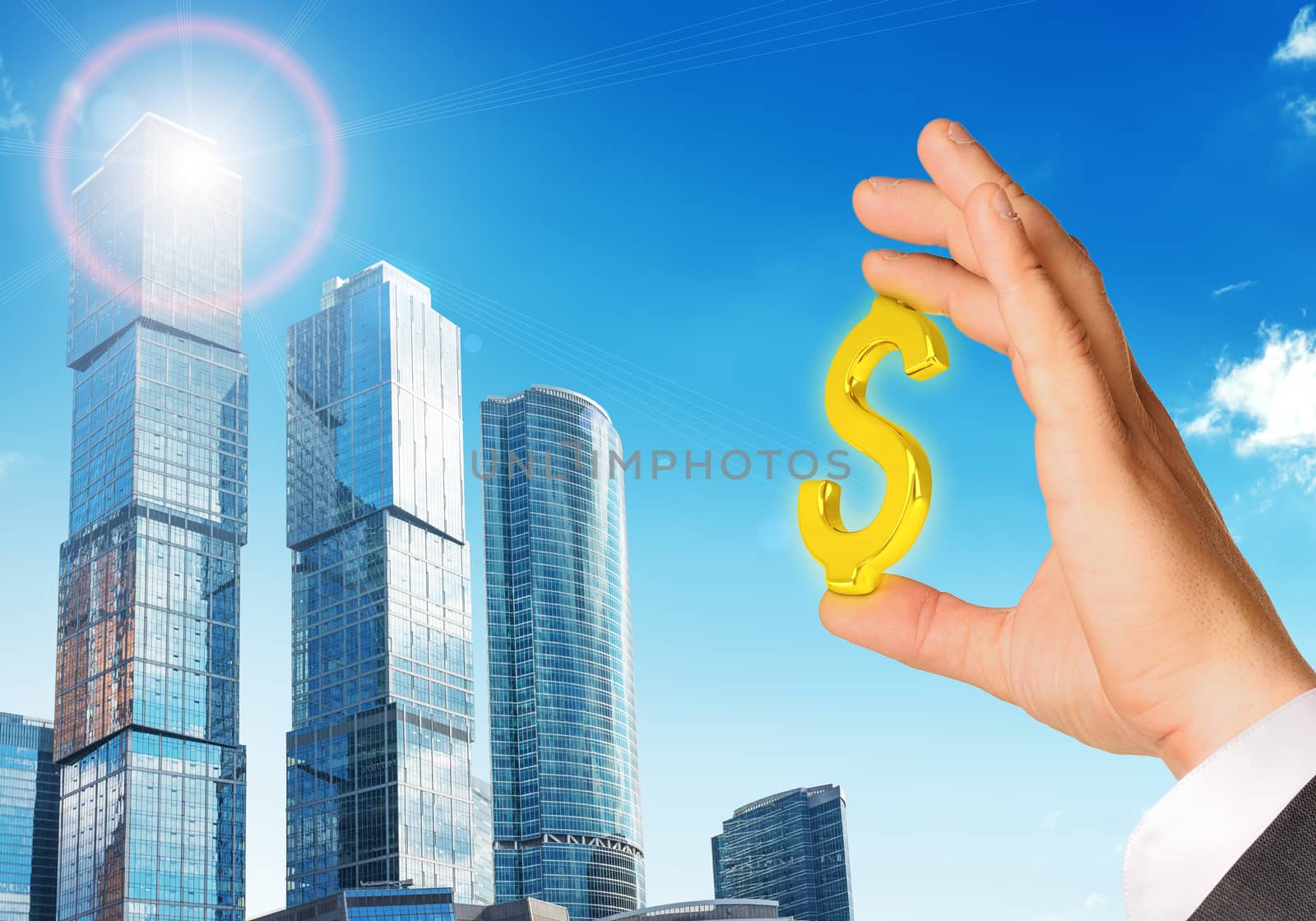 Businessman hand with dollar sign on city background