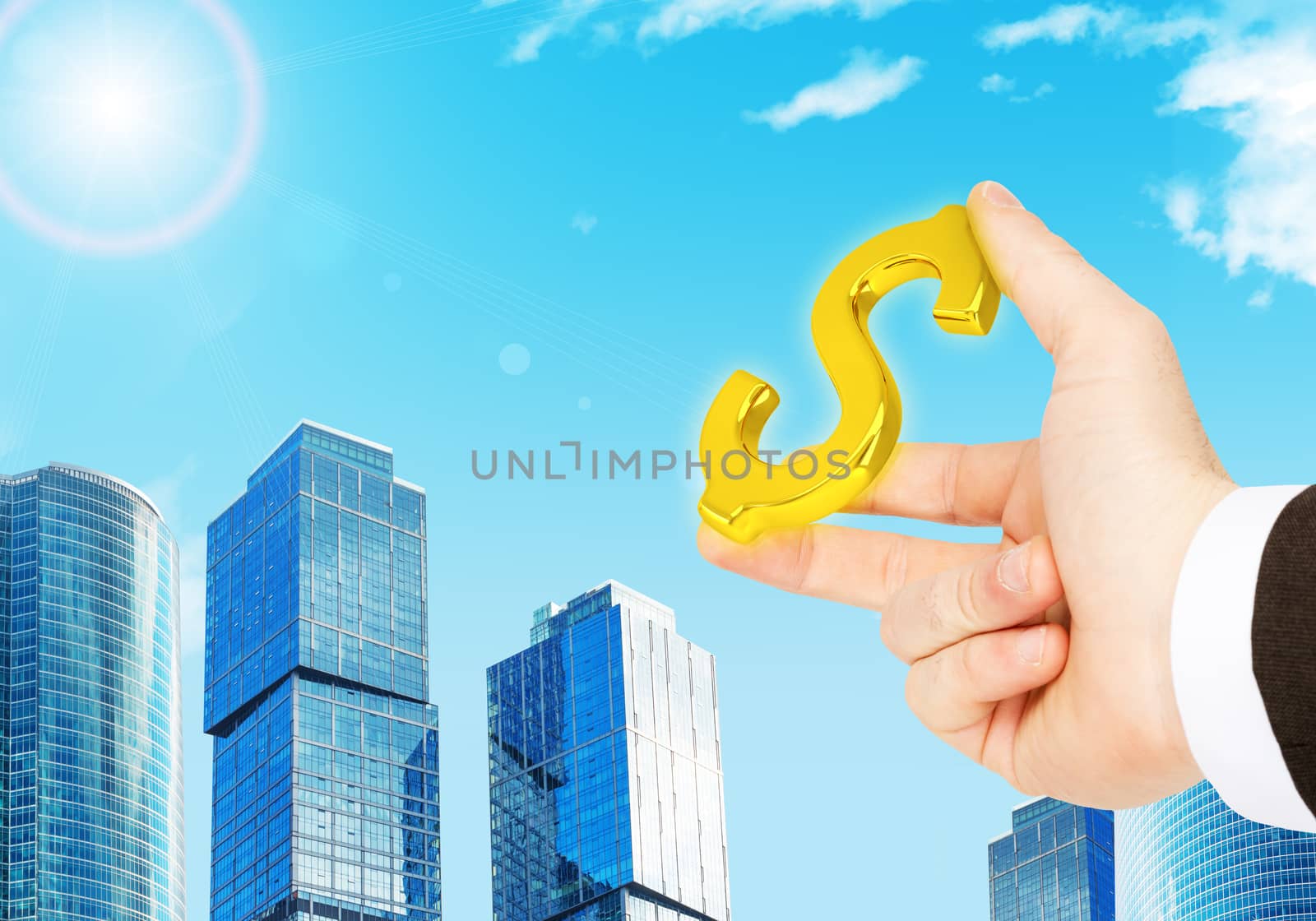 Businessman hand with dollar sign on city background