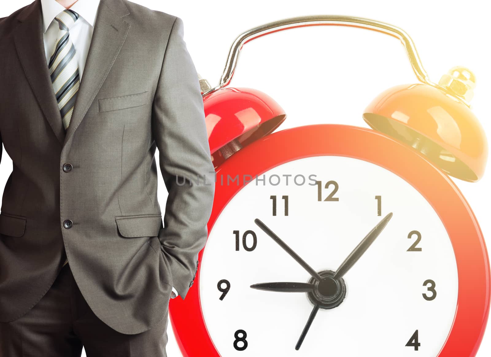 Businessman with big red alarm clock isolated on white background