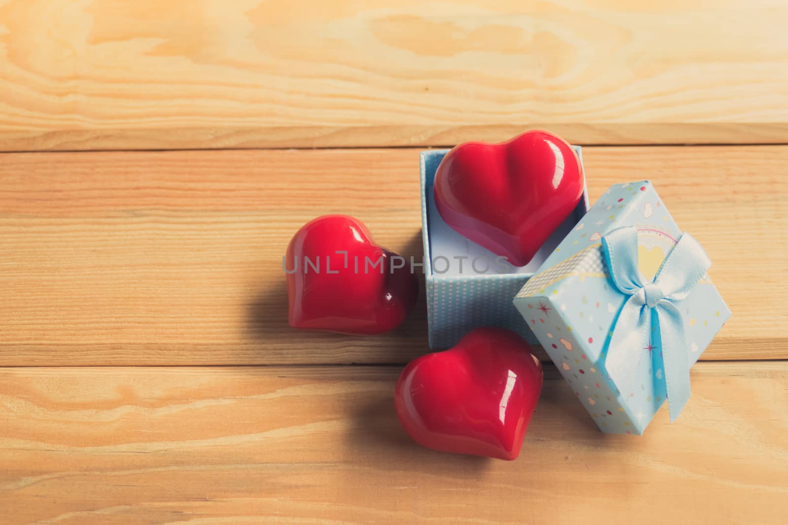 Gift of love. hearty gift. A gift box with a red heart inside. by teerawit