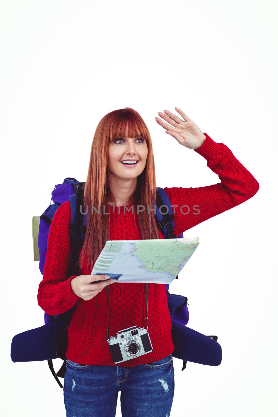 Smiling hipster woman with a travel bag with a map against white background
