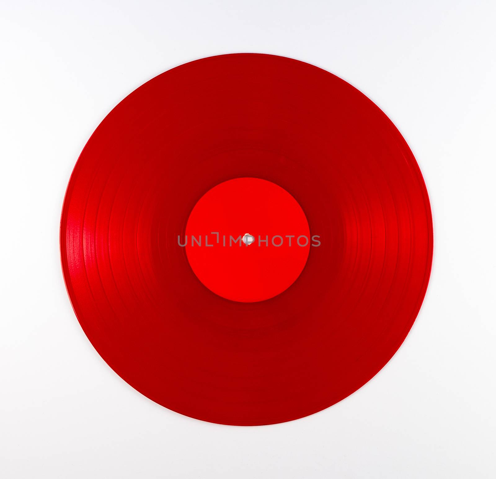Vintage red vinyl record album on white background