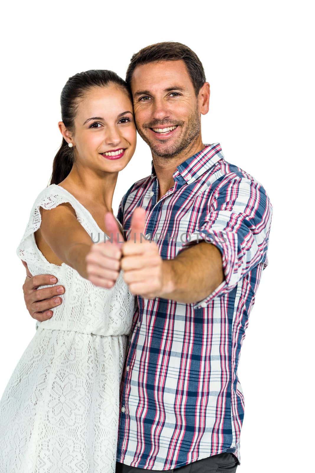 Young couple showing thumbs up at camera on white screen