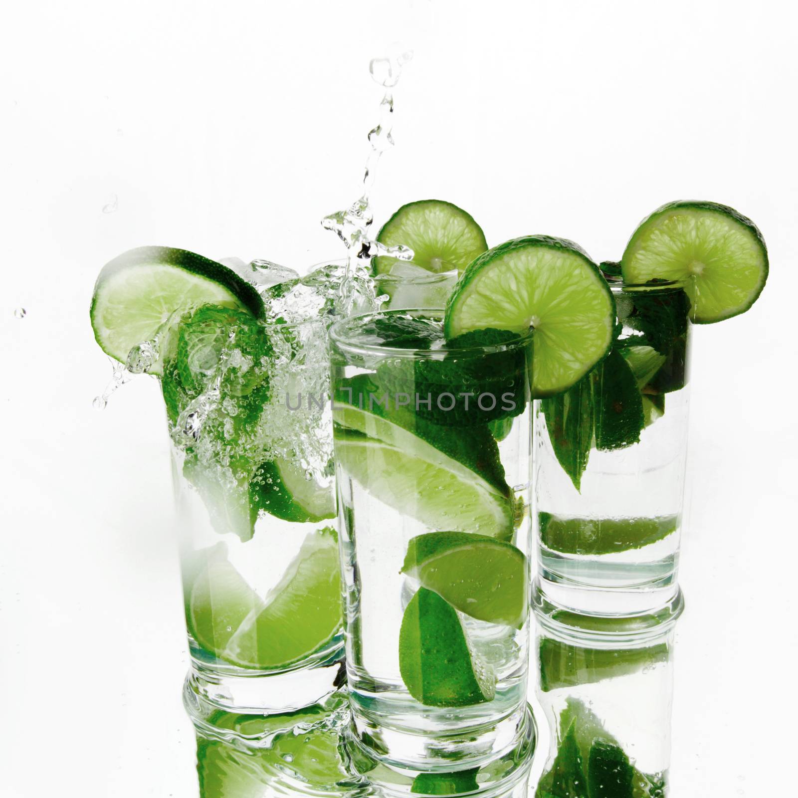 Party mojito cocktails with lime and mint isolated on white background