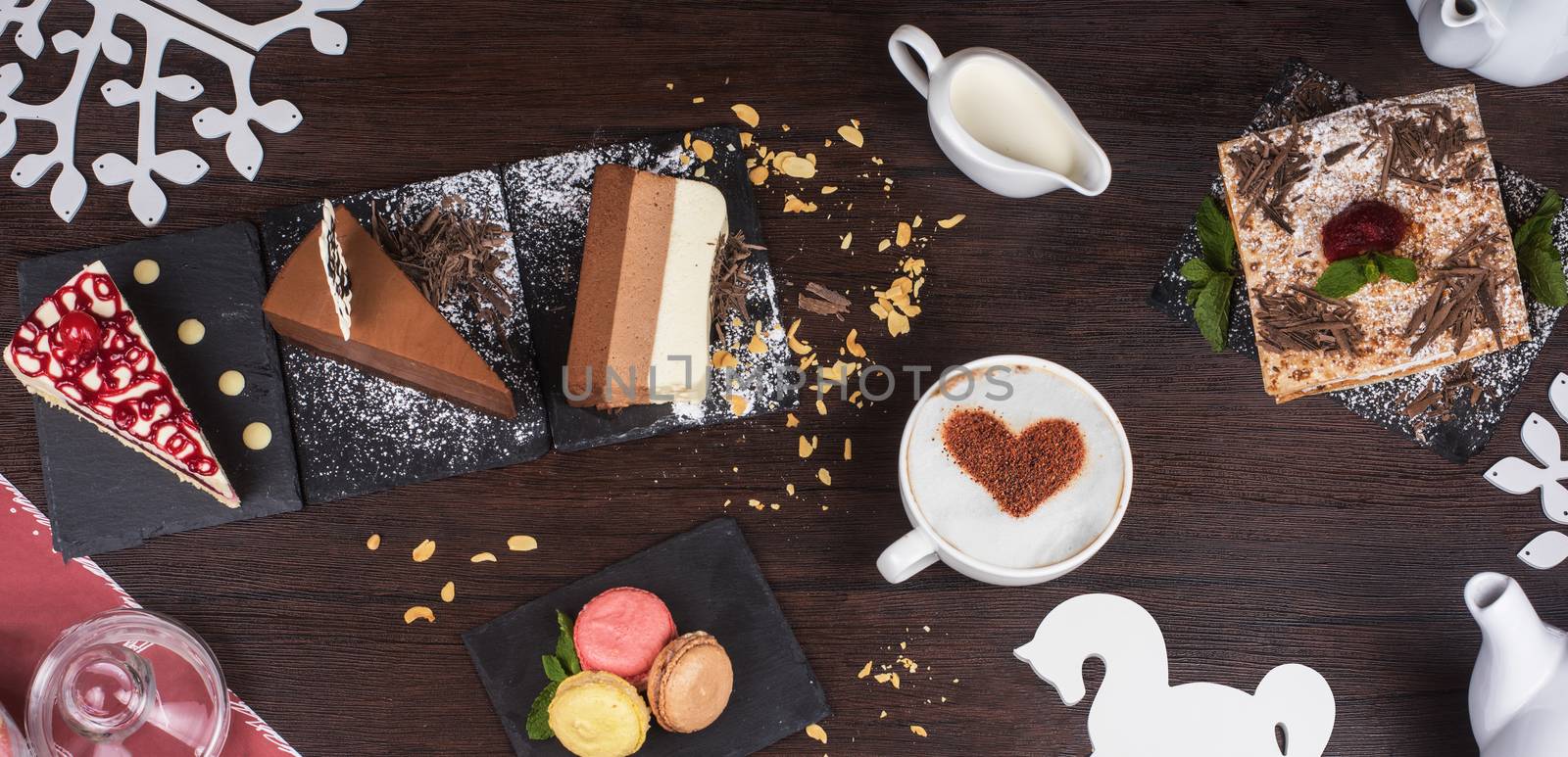 Table with cakes ans coffee cup