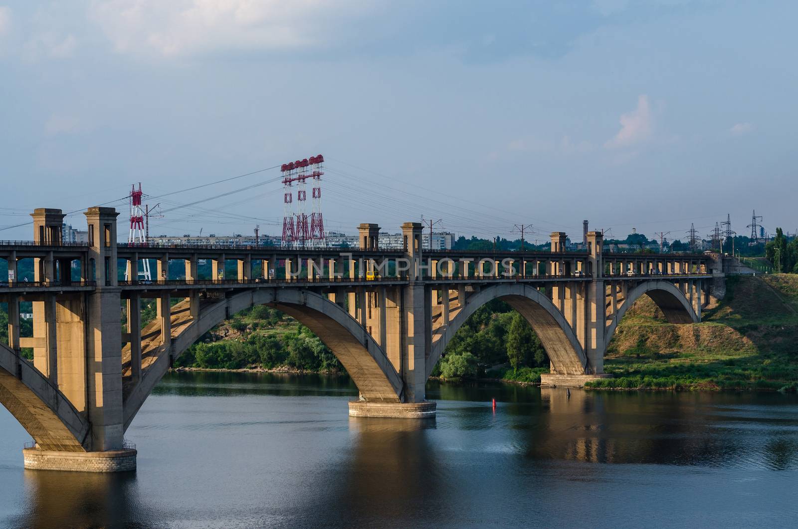 road and rail split-level bridge over the river by Andreua