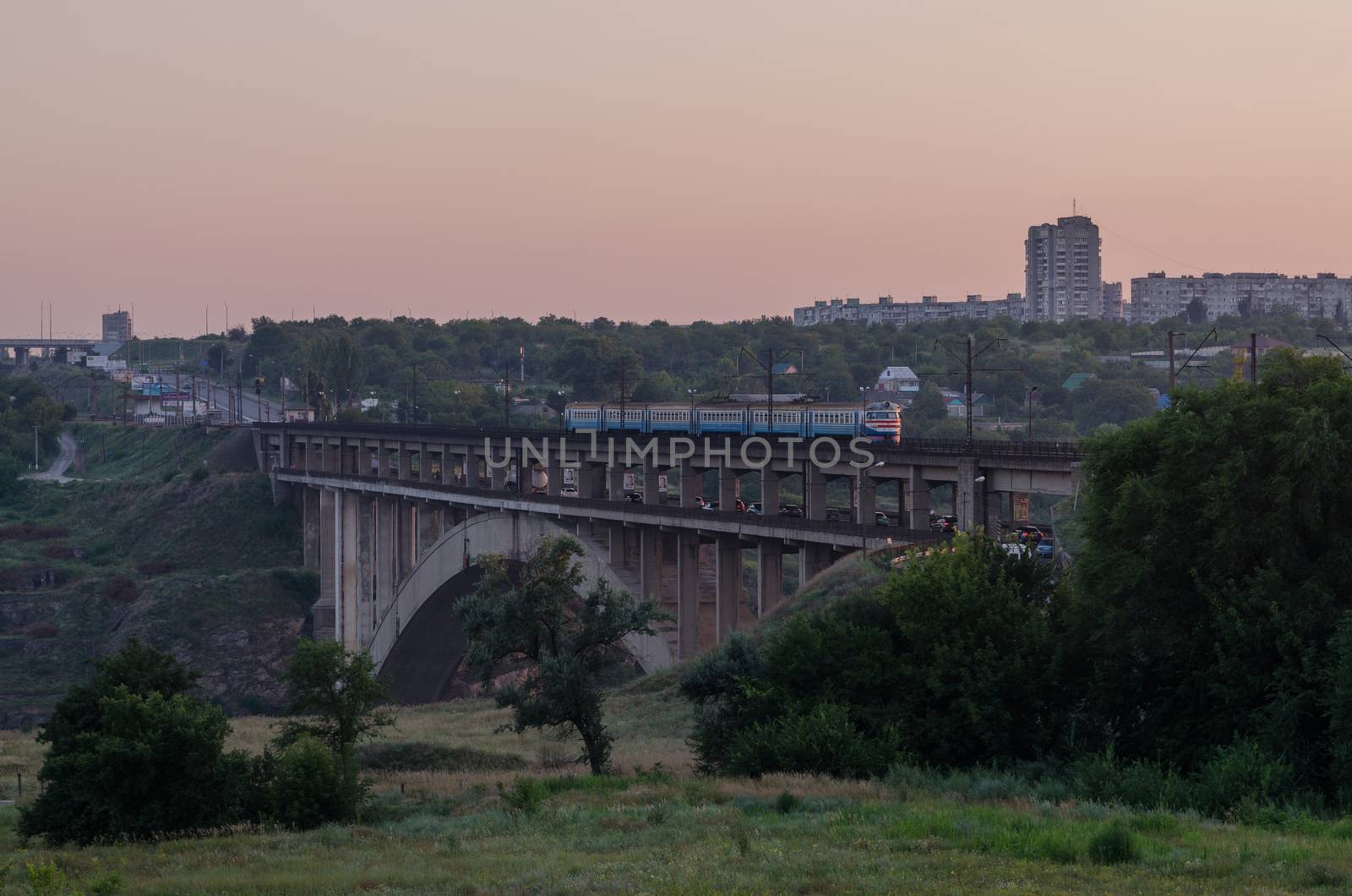 road and rail split-level bridge over the river by Andreua