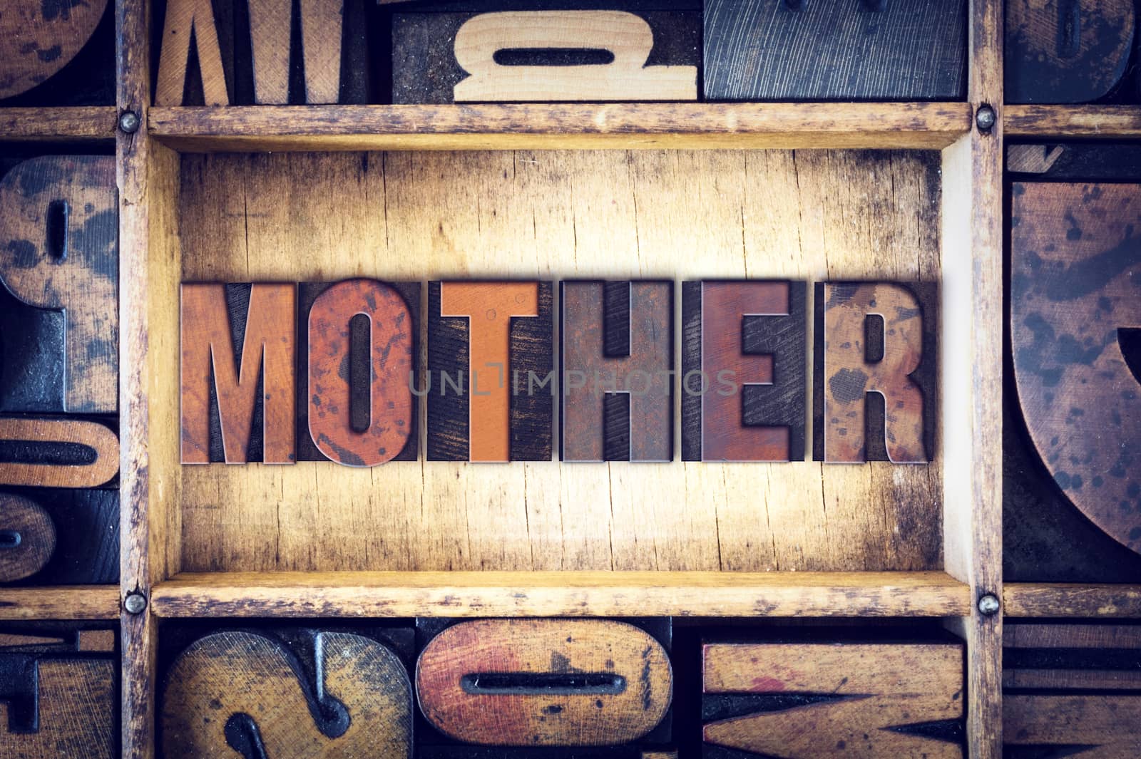 The word "Mother" written in vintage wooden letterpress type.