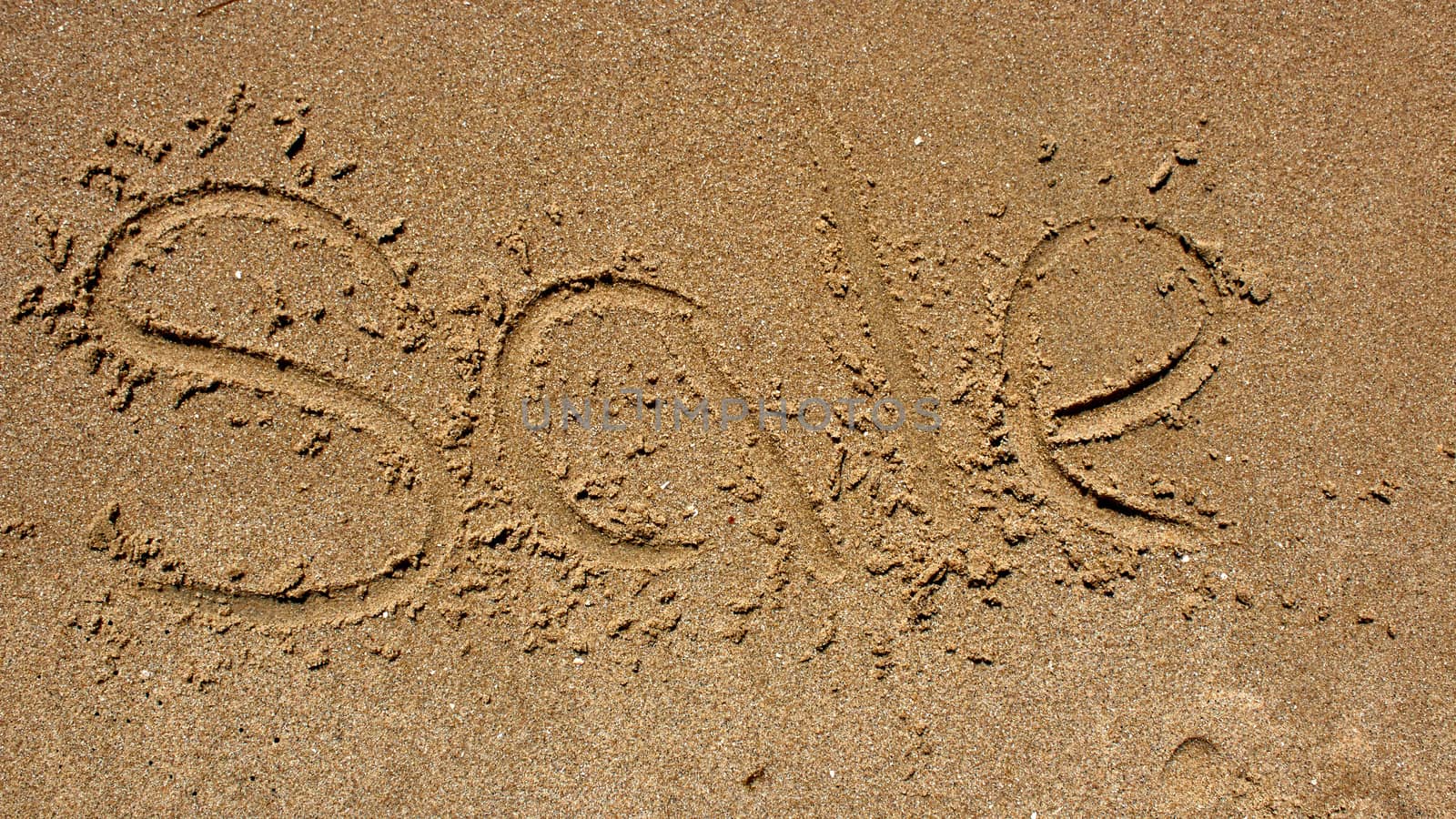 Word sale handwritten in sand by sarymsakov