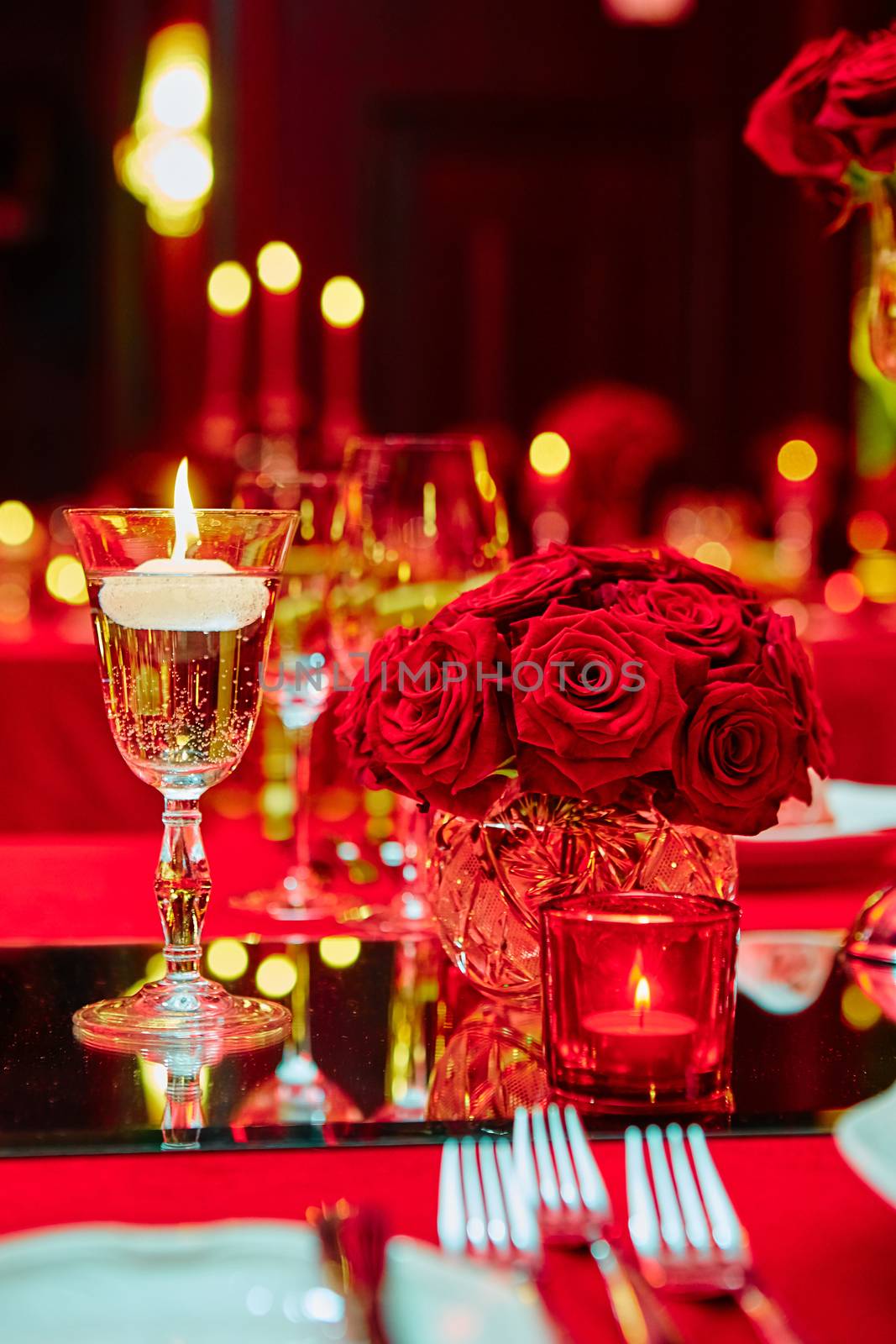 Table set for wedding or another catered event dinner in red colors