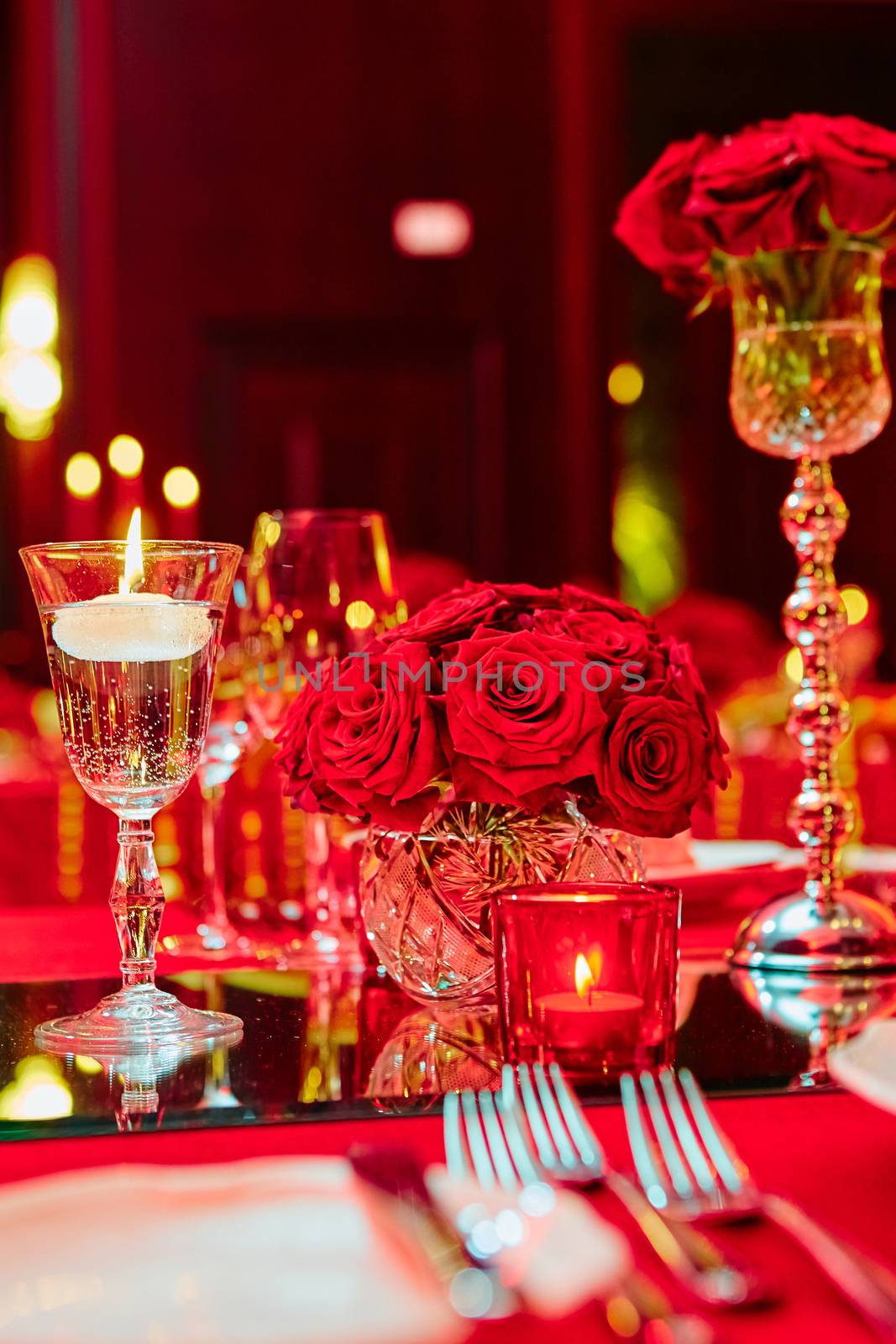 Table set for wedding or another catered event dinner in red colors