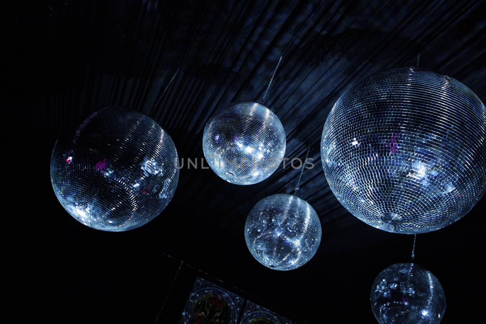 Shiny disco balls on a dark background