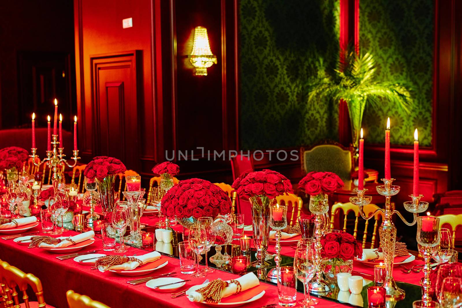Table set for wedding or another catered event dinner in red colors