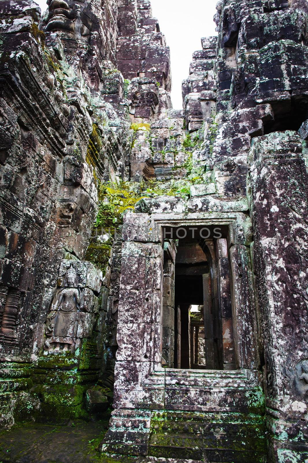 Angkor Wat Cambodia. Khmer ancient Buddhist temple under the picturesque sky with clouds and sunlight. Famous landmark, place of worship in Asia.