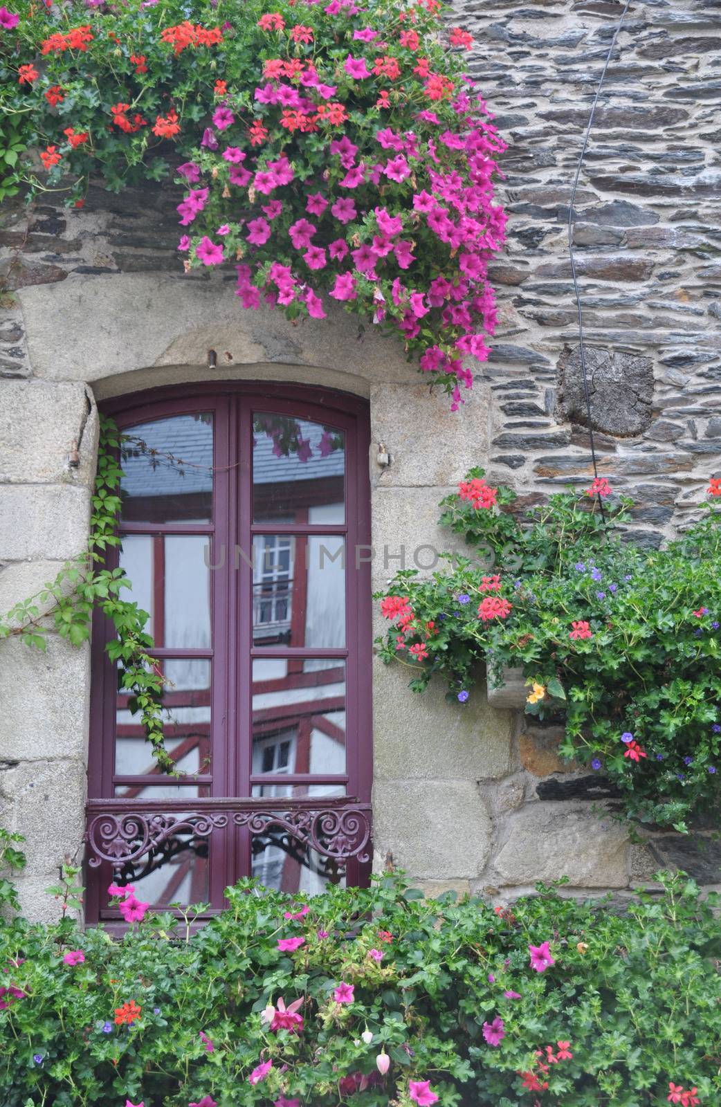 Pretty window in the small medival city of Rochefort-en-Terre, in Brittany France.One of the Plus beaux village de France