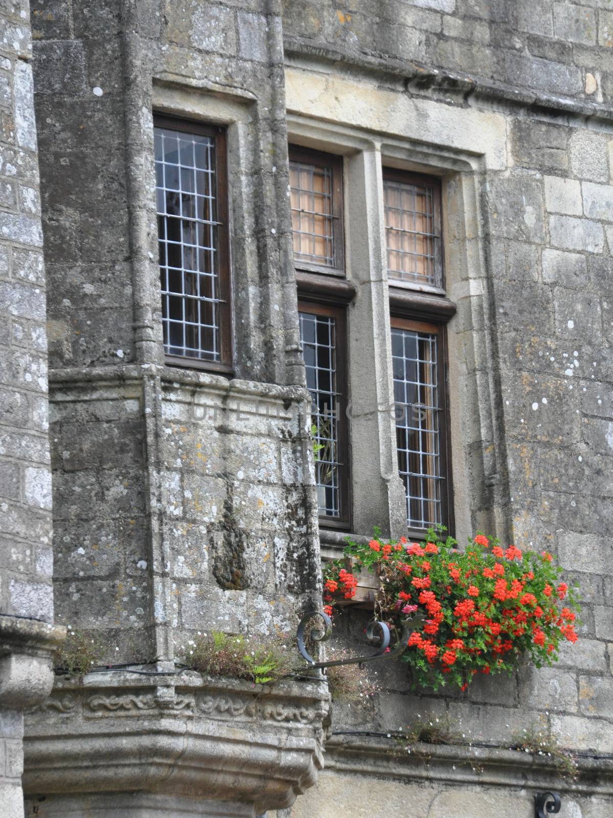 Pretty window in the small medival city of Rochefort-en-Terre, in Brittany France.One of the Plus beaux village de France