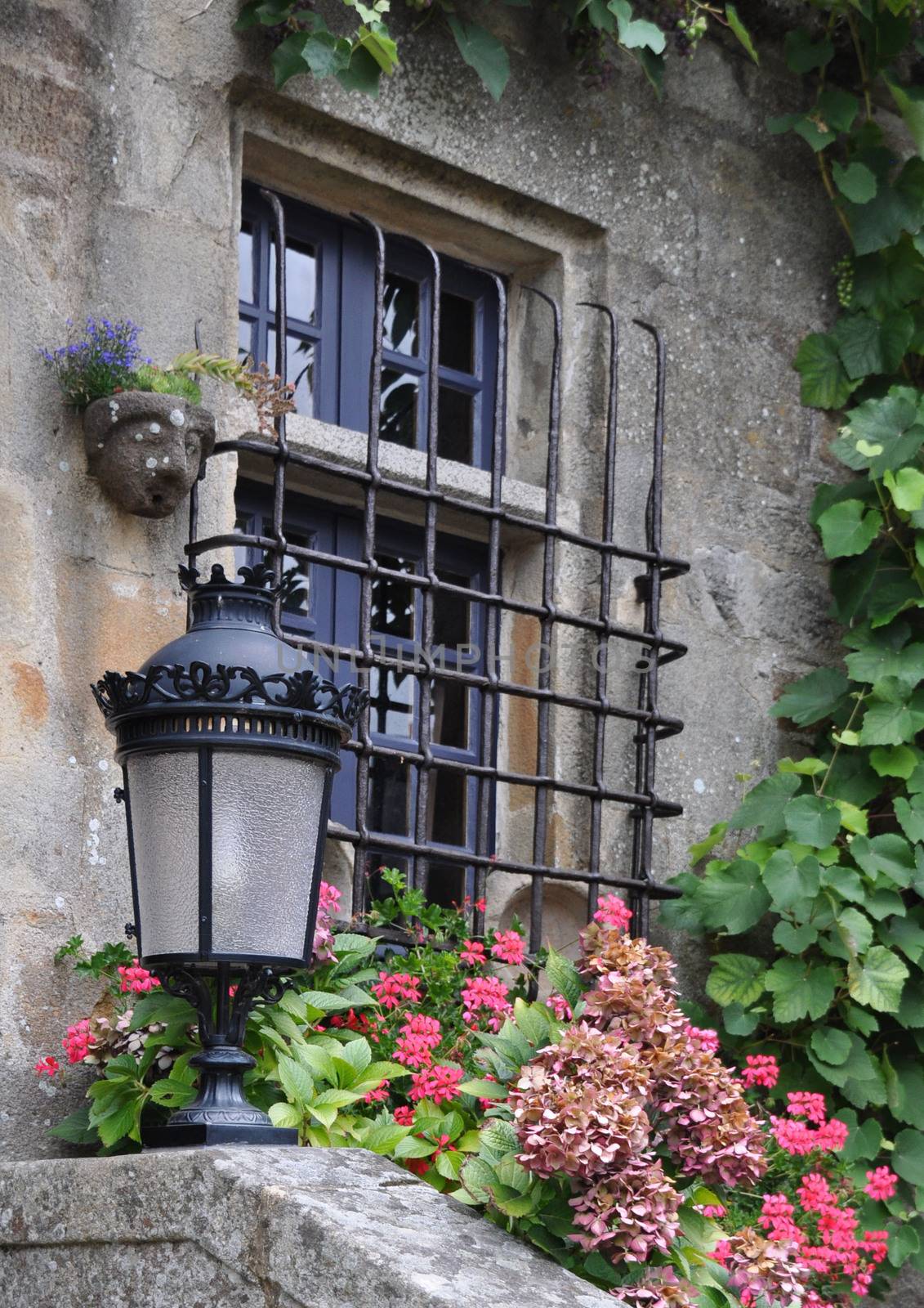 Pretty window in the small medival city of Rochefort-en-Terre, in Brittany France.One of the Plus beaux village de France