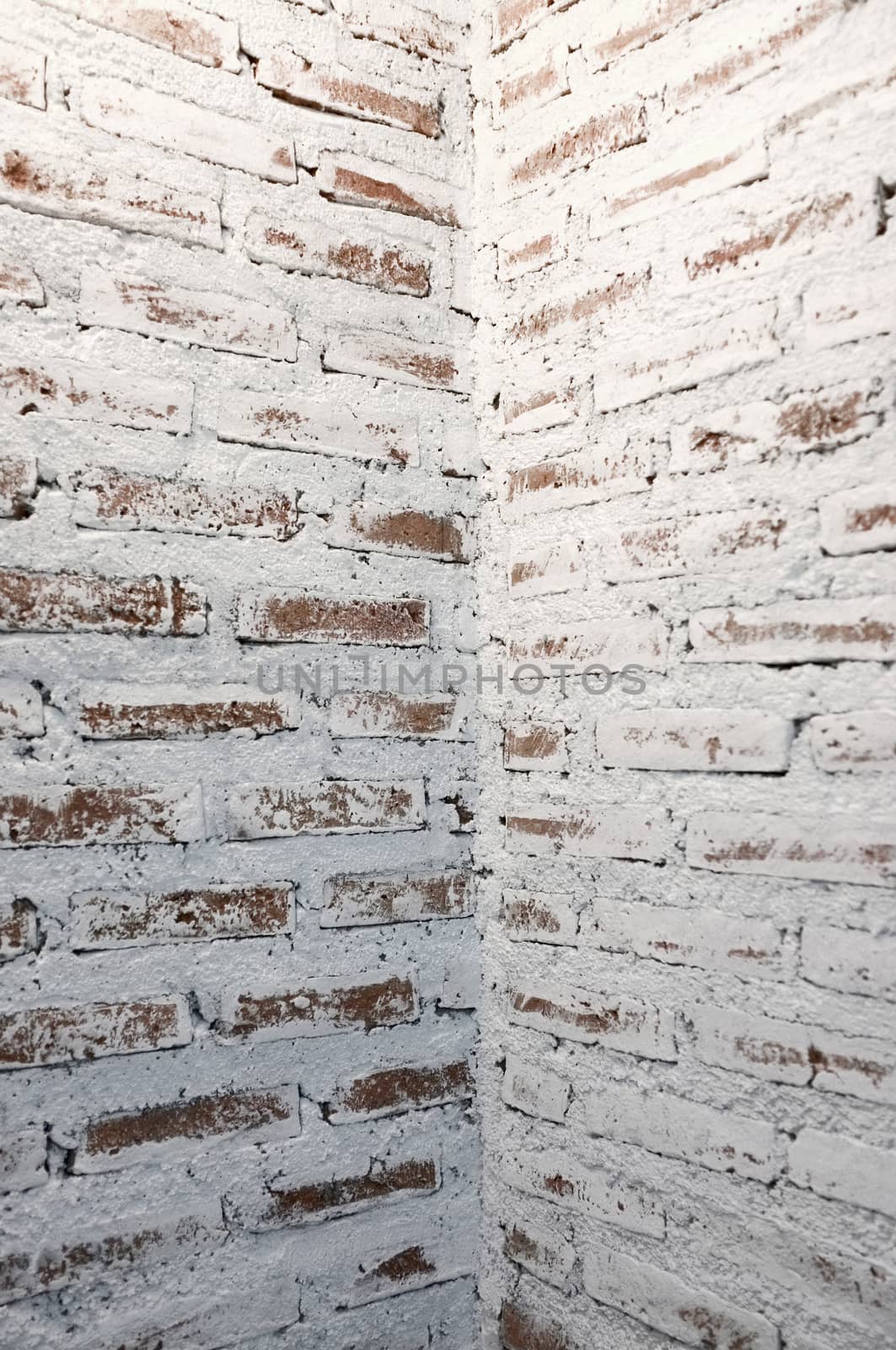 Corner of white brick wall by Hepjam