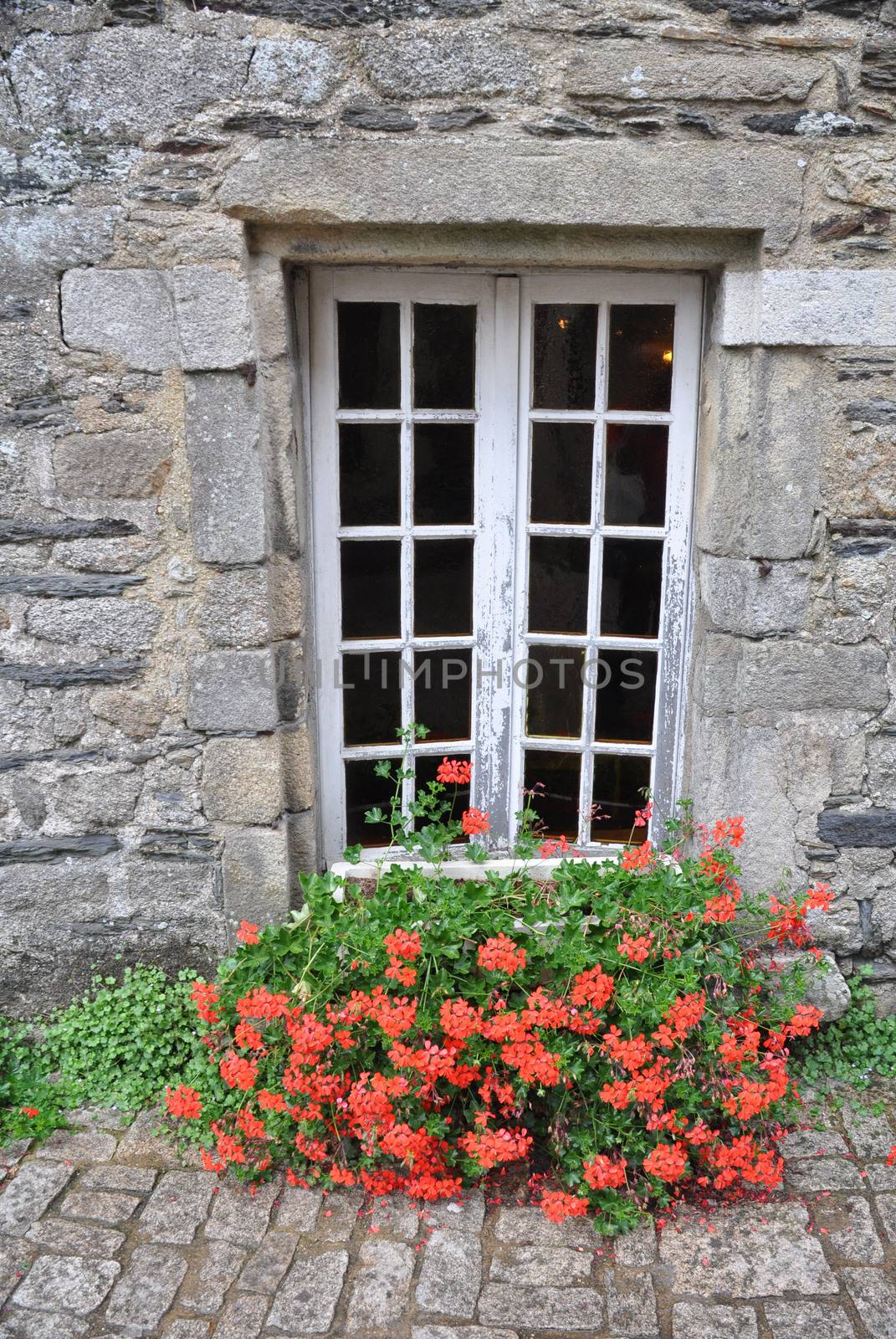 Pretty window in the small medival city of Rochefort-en-Terre, in Brittany France.One of the Plus beaux village de France