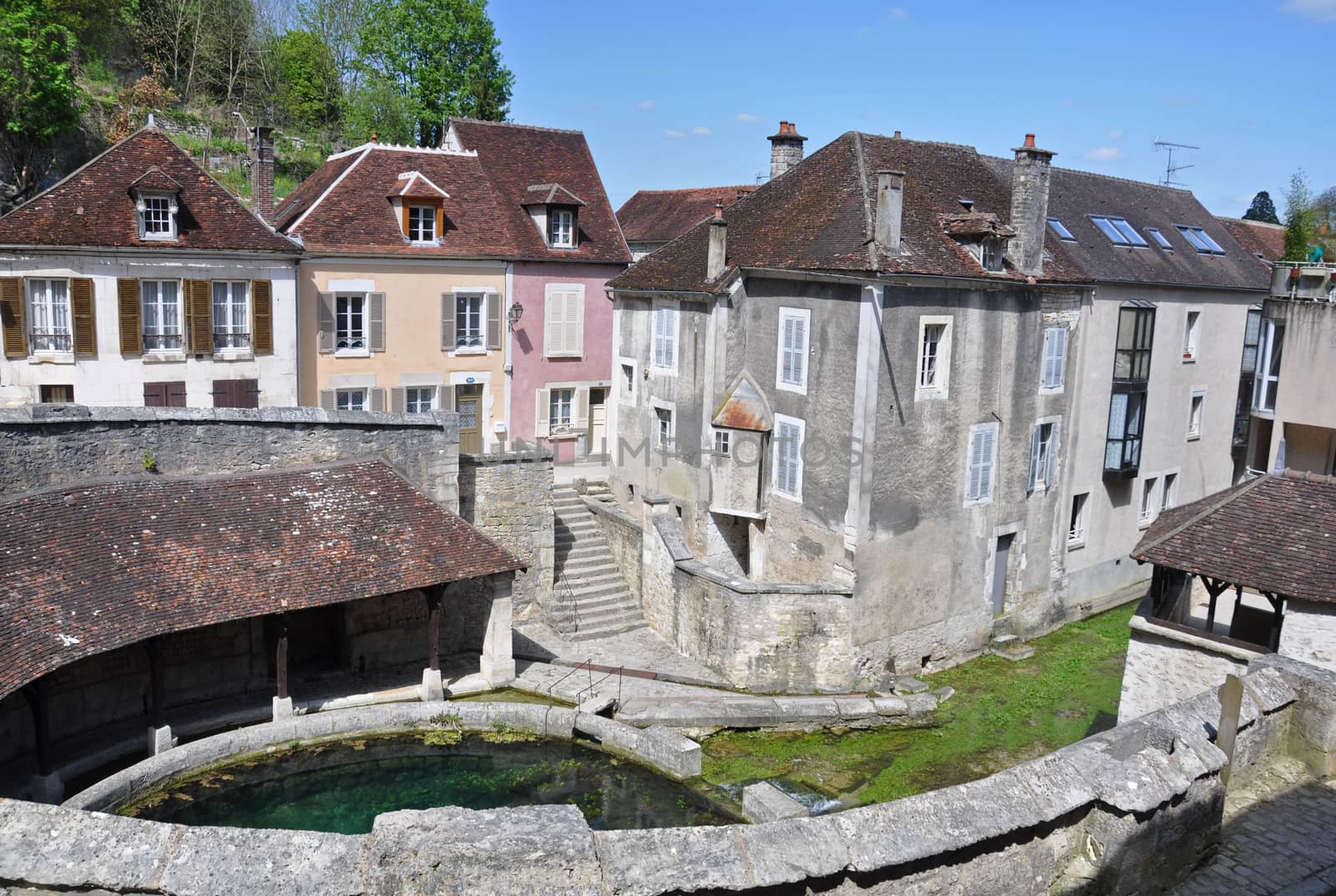 Tonnerre in the Morvan, Burgundy, France sits on the River Armancon. Famed for theTonnerre Fosse Dionne wash house