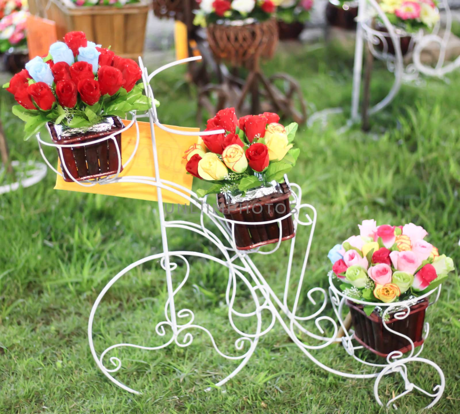 Fake flowers In basket of  bicycle