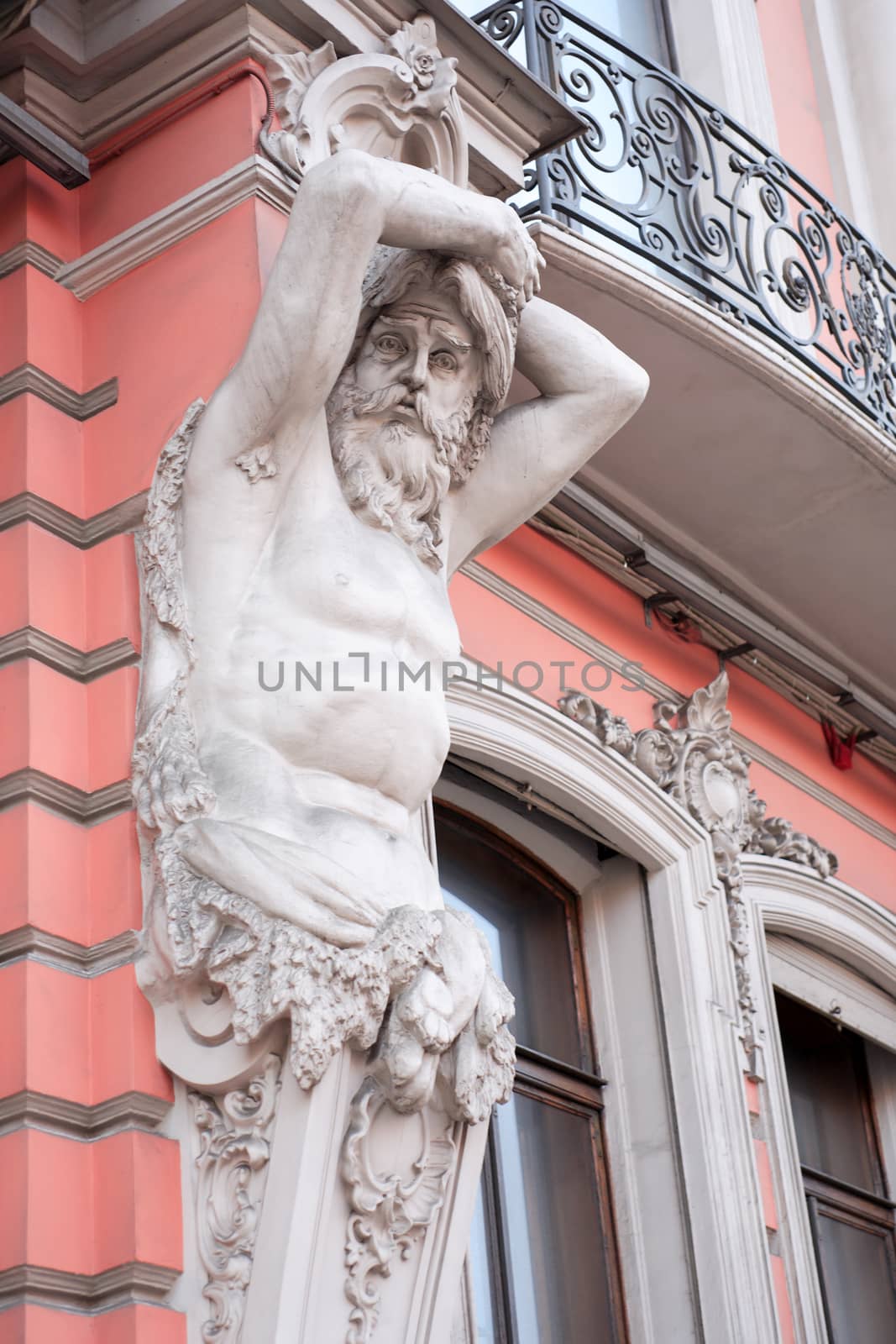 Atlas sculpture closeup on old building facade in St. Petersburg, Russia